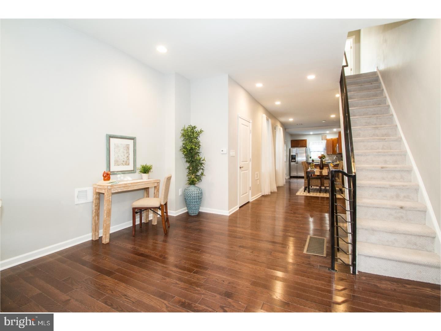 This beautiful home features 3 bedrooms, 1.5 designer baths, central air conditioning, gleaming hardwood floors, a chef's eat-in peninsula kitchen, and a spacious rear patio. Just blocks from the major developments happening around 21st and Washington Ave, this is a unique chance to buy a great home before the area takes off further with countless new amenities. The first floor boasts high ceilings, an open floor plan with powder room, massive open living and dining room, and an outer entrance to a patio large enough to entertain and barbecue. The kitchen features a breakfast bar peninsula, an abundance of wood cabinets, stainless steel appliances, granite countertops, and a gorgeous intricate glass backsplash. The second floor has 3 bedrooms with ceiling fans and an abundance of closets, thick sculptured carpeting, and a gorgeous sophisticated bathroom with exquisite tile work. The large, clean basement is finished and has a separate utility/ storage room with laundry facilities. Located in the heart of Point Breeze. A quick walk from many local favorites, head over to neighborhood coffee shops, Breeze Point Cafe or On Point Bistro for Brunch or Sardine Bar, Dock Street Brewery, or Chick's for drinks. Located along major bus lines for quick access to Center City or other Philadelphia neighborhoods. Schedule your appointment now, at this price, it will not be around for long!