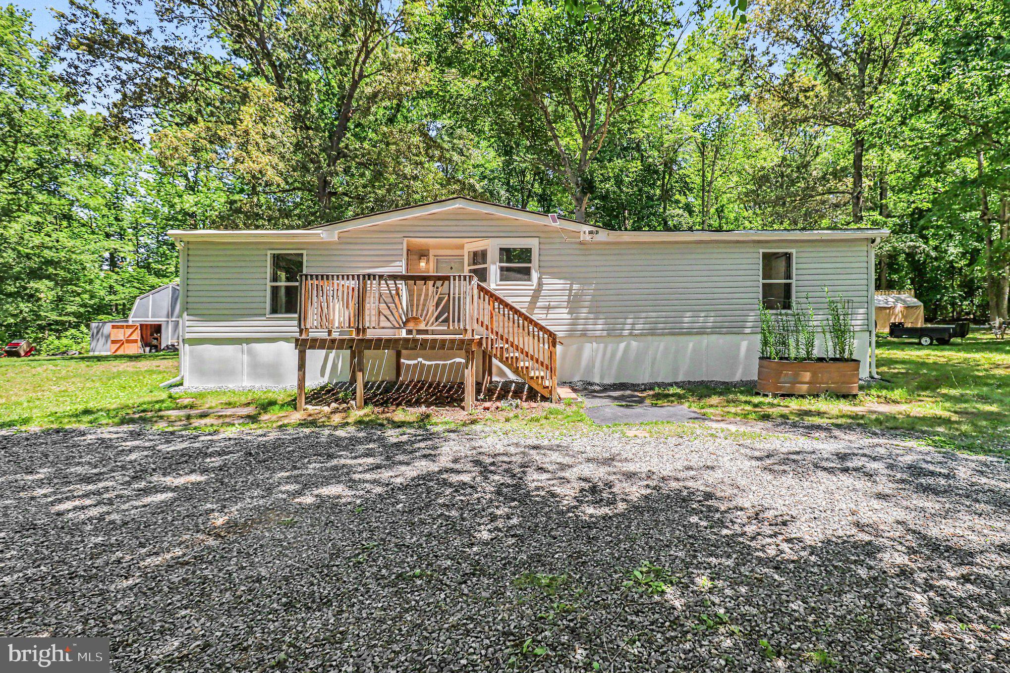 Coming Soon — Beautifully renovated 3-bedroom, 2-bath rambler-style manufactured home situated on 2.43 acres with a circular driveway. This one won’t last long!
Inside, you’ll find a spacious living room that opens to the newly updated kitchen, featuring a breakfast bar, table space, updated stainless steel appliances, and new LVP flooring throughout. The primary suite includes a large closet and private bath with a stand-up shower. Two additional bedrooms share a full hall bath, perfect for guests.
Additional features include a laundry room with washer and dryer hookups, new siding, new windows, a new front door, and newly built front and rear porches. Outside, enjoy the screened-in gazebo, a 16x16 shed with an attached 8x6 lean-to, and plenty of outdoor space.
The home also includes a 3-year-old mini-split system with four indoor units and capacity for a fifth unit, a generator-ready 30-amp hookup at the meter box, and a 7-year-old roof with architectural shingles.
Schedule your showing today!