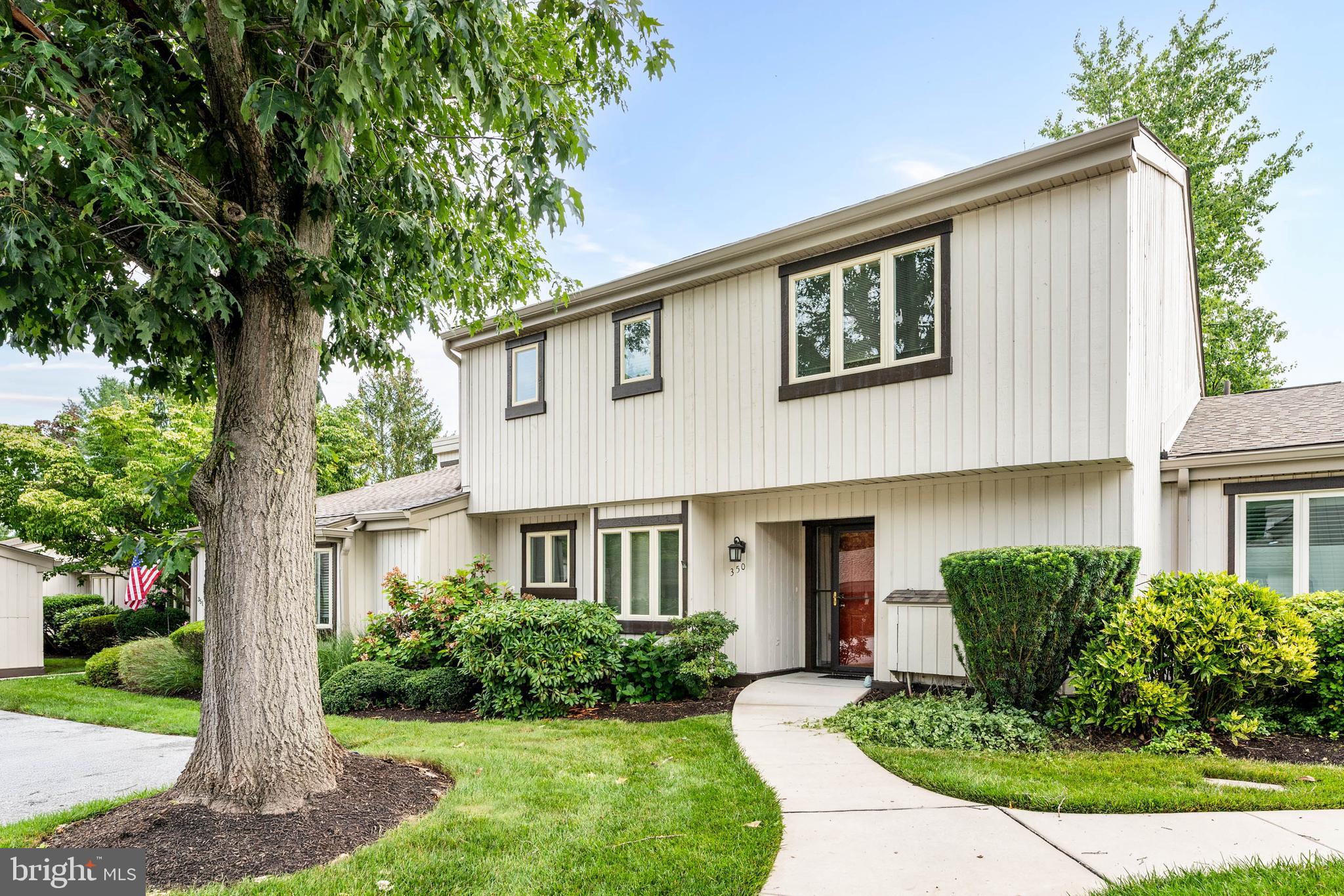 Welcome to 350 Devon Way, a well-maintained home in the highly desirable Hershey's Mill 55+ community. Offering 2 bedrooms and 2 and a half bathrooms, this two-story home provides a comfortable floor plan with plenty of space for everyday living.

The eat-in kitchen features a casual eating area, a pantry, and opens to the dining room, where a sliding glass door leads to a private patio that extends your living space outdoors. Just beyond, the living room offers a fireplace, vaulted ceiling, and a second sliding door to the patio, creating a bright and inviting space to relax or entertain. A first-floor laundry room and powder room complete the main level.

Upstairs, the spacious primary bedroom serves as a peaceful retreat with a walk-in closet, private balcony, and updated en suite bathroom with tile flooring. The second bedroom with its own bath, offers flexibility for guests, hobbies, or a home office. Located in a quiet setting within the community, the home also includes a convenient carport. In recent years, the Devonshire village replaced the walkways and main roofs, with exterior siding updates anticipated in the future.

Residents of Hershey's Mill enjoy a low-maintenance lifestyle with access to a Community Center, library, pool, tennis and pickleball courts, walking trails, and a nearby golf course and clubhouse. Conveniently located near West Chester and Malvern, this home offers the perfect combination of community living and easy access to shopping, dining, and major roadways.