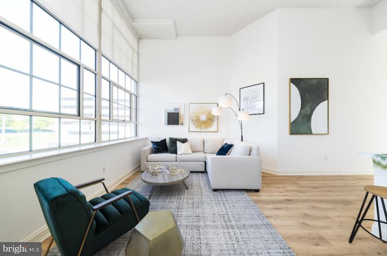 AVAILABLE FOR A JUNE LEASE START DATE!   Enjoy living in this former tuxedo warehouse which has been transformed into fabulous loft style apartments! 2121 Market Street Apartments offers stunning city views!  Located in the Rittenhouse Square neighborhood, the spacious apartments feature super high ceilings with expansive 14-foot windows, open floor-plans and amazing natural light.  The kitchens are fully equipped and include a breakfast bar. Amenities include a resident sky box with a state of the art fitness center and resident lounge, roof deck with breathtaking city views, 24/7 front desk attendant.  We love pets! The building is super pet friendly and welcomes dogs and cats. Trader Joe's is conveniently located on the lower level.  Enjoy everything that the city has to offer at 2121 Market Street. **Photos pictured are of the model unit with a similar floor-plan.