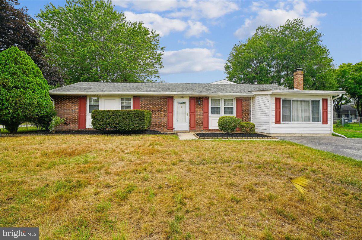 Step inside to a welcoming living room with convenient storage space. The bedroom wing features three generously sized bedrooms, including a primary suite with its own private half bath. A full hall bathroom with a tub/shower combination serves the additional bedrooms.

The heart of the home is designed for both everyday living and entertaining. A separate dining room flows seamlessly into the oversized family room, where a cozy wood-burning stove creates the perfect gathering space. Sliding glass doors lead to the fully fenced backyard, offering plenty of room for pets, play, gardening, or relaxing outdoors.

The spacious kitchen is sure to impress with abundant cabinetry, granite countertops, stainless steel appliances, and a sunny breakfast area for casual dining. Conveniently located between the dining room and family room, it provides an excellent flow throughout the home.

One of this property’s standout features is the impressive detached two-car garage/workshop. Whether you’re a hobbyist, craftsman, car enthusiast, or simply need exceptional storage, this versatile space offers endless possibilities. Complete with pull-down attic stairs leading to additional overhead storage, it’s a rare find that adds tremendous value.

For added peace of mind, the property has just been updated with a brand-new septic system and drain fields, providing years of worry-free service for the next owner.

Travel just minutes to the town of Chesapeake Beach where you can enjoy water sports, beaches and the quaint coastal atmosphere it offers. This home is conveniently located in close proximity to shopping, dining, metro, Joint Base Andrews, Bolling AFB, NAS Patuxent River, Route 4 and major commuting routes to Annapolis, DC and Virginia. 

If you’ve been searching for a well-cared-for home with generous living space, an incredible workshop, major system updates already completed, and located in a quiet neighborhood, this one is not to be missed!