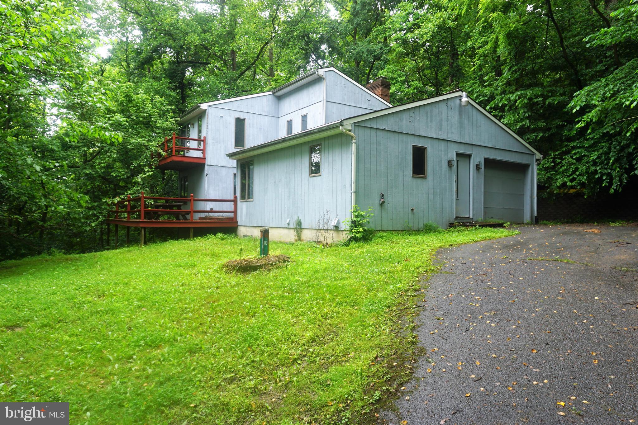 DEEP WATER ACCESS ON THE POTOMAC RIVER- above Dam 5- This listing is for the home located at 30 FITZHUGH (lot 37 HONEYWOOD - ) as well as LOT #37A- which is .27 ac river lot with 90' of Potomac River frontage !  The classic chalet offers  1504 sq ft above grade living space - 3 bedroom, 2 Full bath/ and 1 car garage- THIS HOME  IS IN NEED OF SOME TLC and IS PRICED ACCORDINGLY . CASH PREFERRED! NO GOVT LOANS!  2 fireplaces/ multi tier decking/Anderson windows/ newer HVAC 2017- Home has terrific bones. Just waiting for a new owner to bring her beauty back. Private large .91 acre lot in Sought after Honeywood on the Potomac community. This could be a beautiful Private retreat, weekend getaway or  your own  primary residence . Community deep Potomac river access as well as community swimming pool.  Close to I-81 , Maryland, Shopping & Spring Mills School District