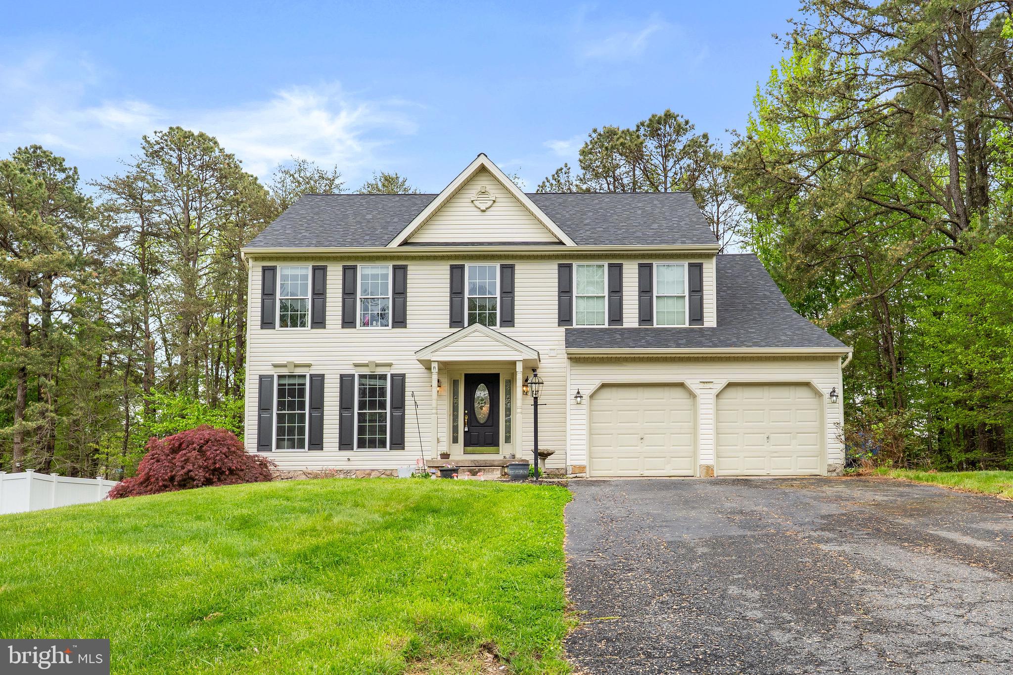 Tucked away at the end of a quiet road in a highly desirable community, this 5 bedroom, 3.5 bath Colonial offers the perfect blend of space, privacy, and versatility. The main level flows effortlessly, while the upper level features four spacious bedrooms, including a comfortable primary suite. One of the standout features of this home is the finished basement, thoughtfully designed to function as a private in-law suite or separate apartment. Complete with a kitchenette, living room, bedroom, laundry area, full bath and separate entrance it’s perfect for extended family, guests, or even potential rental income. Enjoy the convenience of a two-car garage and the added privacy at the end of the road. With its desirable location, flexible living options, and room to grow, this home checks all the boxes.  Schedule your private tour today!