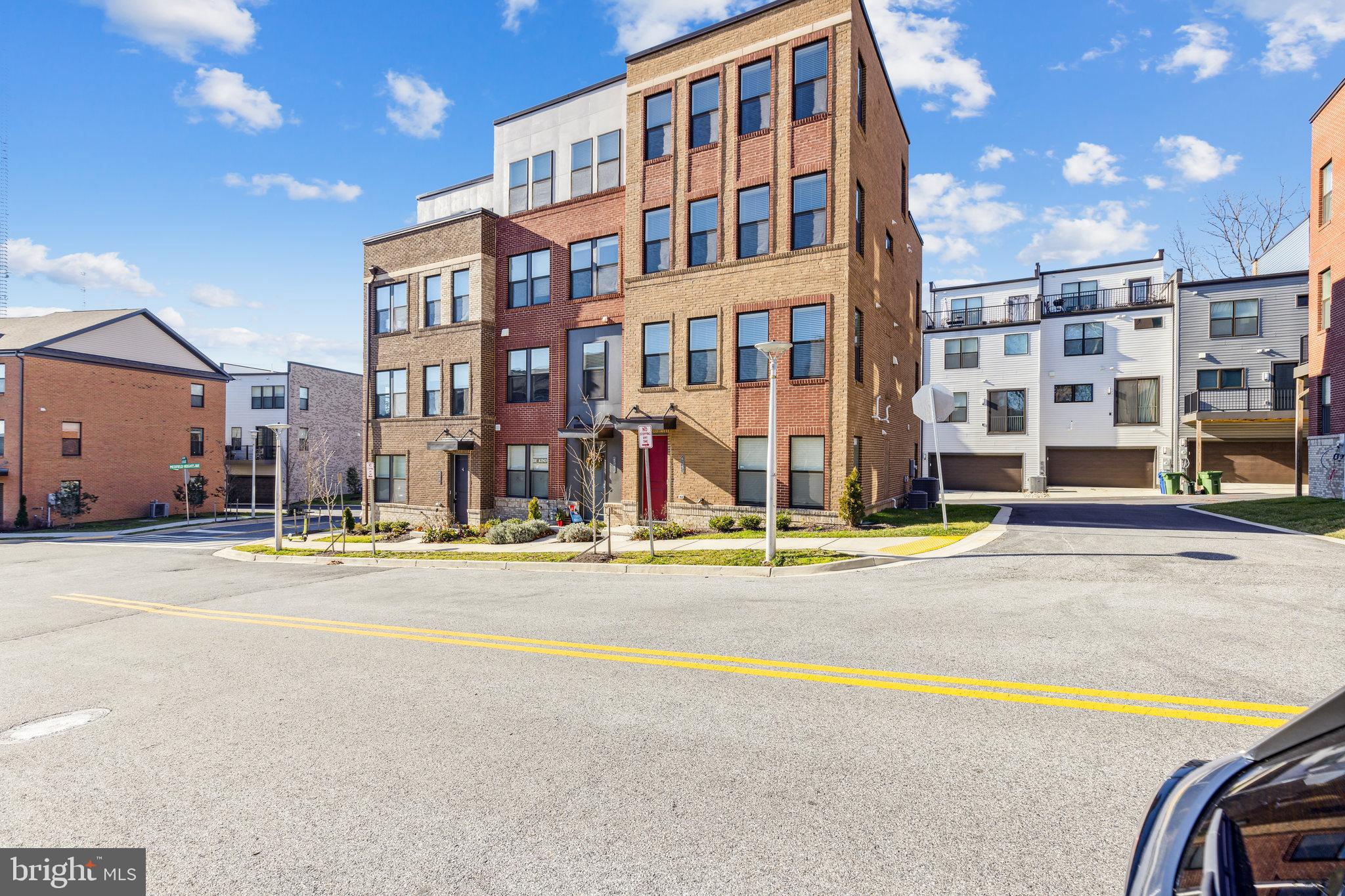 Welcome to this incredible 4-story, end-unit townhome in the newer community of Roland Heights in Medfield! Your future home offers 4 Bedrooms and 3.5 Bathrooms. Enter the lower level from the 2-car attached garage, where you’ll be greeted by a Rec Room and 1/2 bath. Upstairs, you’ll find the spacious main living-level with a Living Room, Dining area, and eat-in Kitchen. The Kitchen features gorgeous granite countertops with shaker-style cabinetry, stainless-steel appliances with a gas stove, and a large center island with additional seating x4—perfect for entertaining! The next level is where you’ll find the Primary Bedroom, which has a walk-in closet and private bath with dual sinks. There are 2 additional bedrooms and a hallway closet laundry. The uppermost level has a second living area, 4th bedroom, and a full bathroom. Great location! Close to Union Craft Brewing, JHU, the Rotunda, and fine dining on the Avenue! Available for immediate occupancy! Call now to schedule a showing!