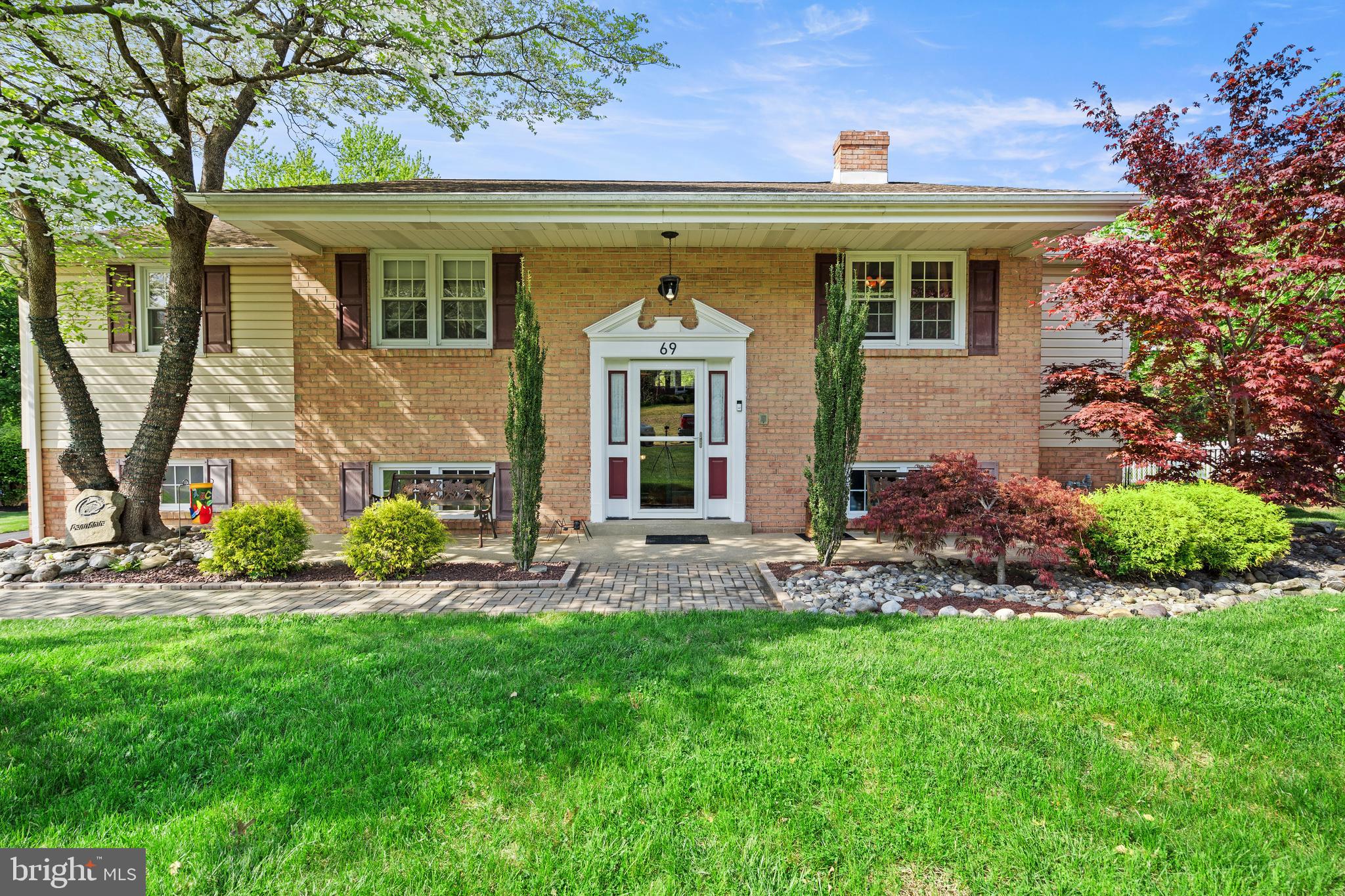 Welcome to 69 Christopher Drive, a rare opportunity to own one of the largest and most
extensively upgraded homes in this highly sought-after neighborhood, located within the
award-winning Council Rock School District. Thoughtfully expanded and renovated, this
home offers a unique blend of space, craftsmanship, and functionality that truly sets it
apart from anything else in the community.
 Boasting approximately 2,800 square feet of living space, this home is designed for both
everyday comfort and elevated entertaining. The first floor great room features beautiful
teak hardwood flooring providing warmth and character throughout. The kitchen is a
standout, complete with hickory cabinetry, soapstone countertops, a gas range, and an
additional built-in wall oven—offering two ovens, which is perfect for hosting,
entertaining, or preparing multiple dishes with ease. An open layout with island seating
at elevated soapstone countertops and a dedicated eat-in area makes it the true heart
of the home, conveniently positioned next to a sliding glass door that leads directly to
the outdoor deck for seamless indoor-outdoor living.
 Directly from great room leads to the full hallway bath with ceramic tile, custom oak
cabinetry and slate sink top. The hallway continues to three generously sized bedrooms
with oak floors.
 The master bath includes a heated ceramic tile floor, ceramic tile walls and shower with
glass enclosure. The spacious primary suite offers vaulted ceilings, a separate sitting
area, walk-in closet, and its own gas stove fireplace, along with a dedicated mini-split
HVAC system for personalized comfort.
The lower level provides exceptional versatility, featuring a finished game room with
ceramic tile flooring and a fireplace—creating the perfect space for a media room,
playroom, or entertainment hub. Whether it’s hosting game nights, setting up a pool
table, or creating a dedicated space for kids, this level offers endless flexibility and
separation from the main living areas while still feeling warm and inviting.
 Additional living and entertaining space includes a stunning Florida room with tongue-
and-groove woodwork, ceramic tile flooring, and a gas fireplace—ideal for year-round
enjoyment.
 Outdoor living is equally impressive with an expansive 800 sq ft EP Henry paver patio,
complete with a covered hot tub area, ideal for relaxing or entertaining guests. Two
additional storage sheds provide added convenience.
 
Car enthusiasts, hobbyists, or those needing extra storage will appreciate the oversized
4-bay garage, offering approximately 1,000 square feet with 11-foot ceilings in two
bays—an incredibly rare feature in the neighborhood.
 Additional highlights include gas forced-air heating and central air conditioning, public
sewer, and a well water system equipped with a stainless steel submersible pump, acid
neutralizer, water softener, and filtration system.
 Additional Note: The driveway will be freshly recoated prior to settlement, offering
added curb appeal and peace of mind for the next owner.
 
This is a truly one-of-a-kind home combining size, upgrades, and location—an
exceptional opportunity in a neighborhood where homes like this rarely become
available.