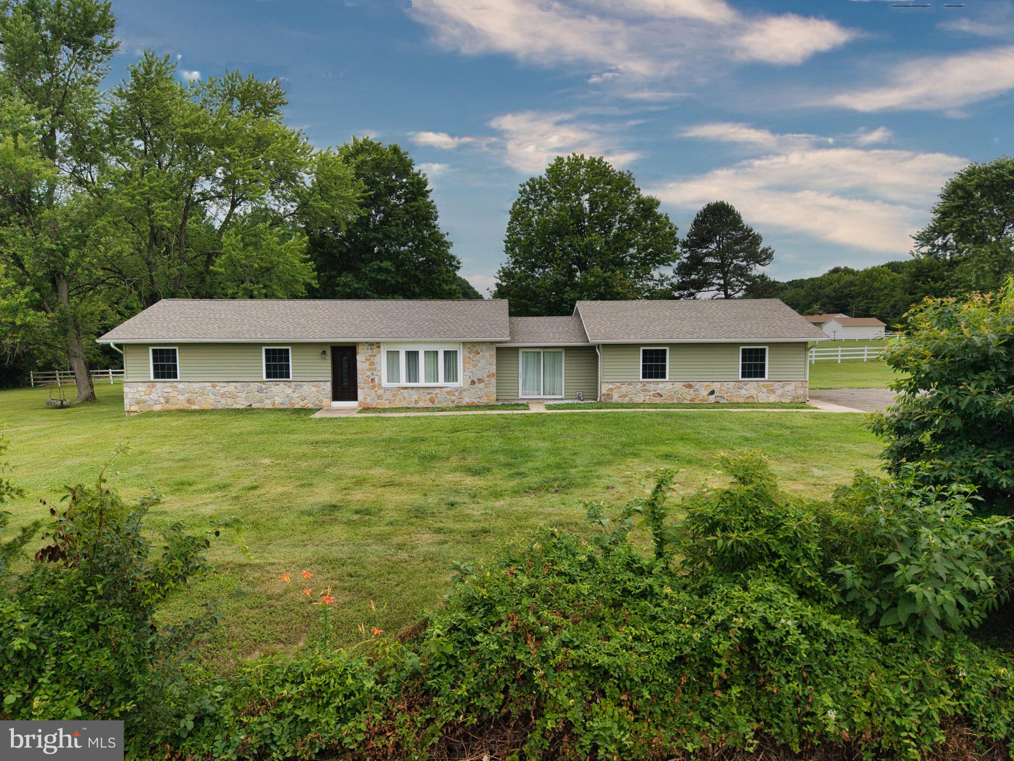 Welcome home to this beautifully renovated rancher tucked away on a quiet dead-end road, offering the perfect blend of privacy, comfort, and modern updates. Situated on a lovely, well-maintained lot, this 3-bedroom, 2.5-bath home has been thoughtfully updated throughout, creating a move-in ready opportunity for its next owners. 
 
Inside, you’ll find a completely refreshed interior featuring an updated kitchen with new flooring installed in 2024, showcasing attractive Pergo Arden Blonde Hickory floors. The spacious layout offers comfortable one-level living with the added bonus of a full basement, providing abundant storage space and endless possibilities for future finishing or recreation. 
 
Major improvements provide peace of mind, including a new roof (2019), new windows, doors, and siding (2021), a new hot water heater (2025), and updated HVAC ductwork with new registers and returns completed in December 2024. The basement has been professionally waterproofed with a new French drain system installed by Just Basements, and the transferable warranty will convey to the new owners. 
 
Additional updates include a recently pumped septic system and a water softener serviced by Sharp Water Service. A pellet stove adds warmth and efficiency during cooler months. Please note that the electric baseboard heat in the salon area has been disconnected. 
 
Enjoy the tranquility of country living while still being conveniently located to nearby amenities. This meticulously maintained home is ready for you to move in and make it your own!