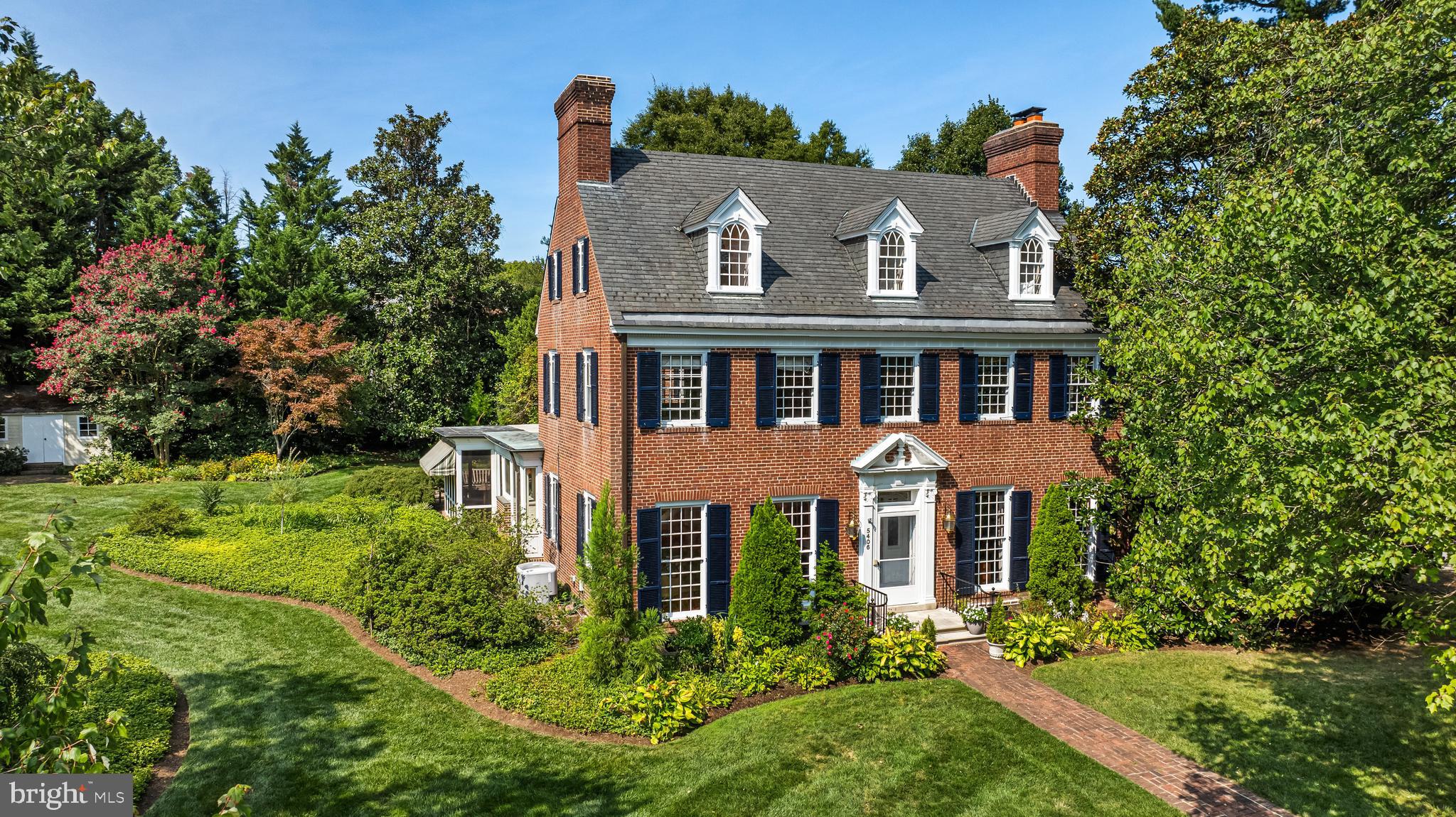 Elegant all brick 5 Bedroom, 3/1 Bath Georgian home set amidst beautiful gardens on tree-lined St Albans Way. Gracious Foyer with archway to classic staircase. Formal Living Room with fireplace and Dining Room with wet bar set within arched alcove. Handsome Library with fireplace and custom built-in bookcases. Stunning Family Room addition with window walls, radiant heated ceramic tile floor, gas fireplace, breakfast area and French doors leading to the Screened Porch. Custom Kitchen with Wm Ohs cherry cabinetry and granite counters. Sumptuous Primary Suite with spa Bath and custom fitted Dressing Room shares the 2nd Level with 2 additional Bedrooms and Shared Bath. 2 Bedrooms and Bath are found on the 3rd Level. Main Level additions, Primary Suite, Screened Porch and Patio designed by Jamie Snead of Ziger/Snead Architects. Attached 2-car Garage, bluestone Patio with curved seating wall all on .67 acre beautifully landscaped double lot. CAC is on main level only.