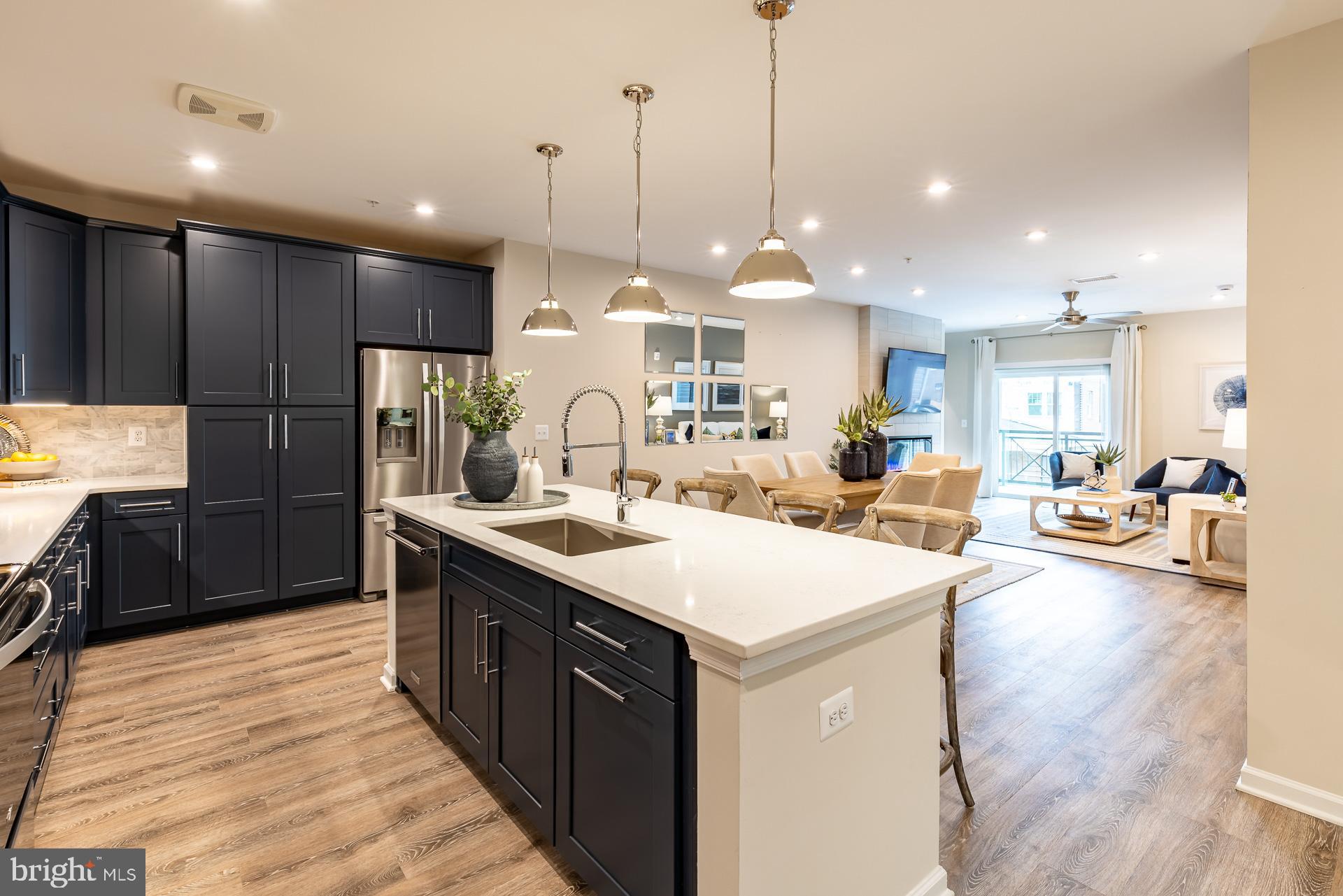 Find Your Perfect Fit at Gatherings at Cabin Branch. Whether you're looking to elevate, downsize, or rightsize your lifestyle, this 55+ community in Clarksburg offers the perfect balance of comfort and convenience. Choose from five stylish condo floorplans with elevator access and enjoy amenities like a billiards room, gym, golf simulator, and more. Join community events at the clubhouse or explore Clarksburg Outlets for shopping and dining. At Gatherings at Cabin Branch, you’ll be close to everything that matters most—daily conveniences, top-tier amenities, and cherished connections. This spacious, 2-bedroom condo is MOVE-IN READY in Clarksburg’s brand-new 55+ community, Gatherings at Cabin Branch! Come home to an open-concept, low-maintenance home featuring a chef-inspired kitchen that connects to your dining area and living room. Enjoy a walk-in pantry, private balcony, and an expansive secondary bedroom and bath – perfect for guests! The impressive primary suite features 2 closets and a spa-inspired bath with dual vanities, a linen closet, and an oversized shower with a seat. Included features: Elevator Access, 1-car garage, designer flooring in select rooms, large kitchen island/breakfast bar with center sink, 42” kitchen cabinets, and more. This home is rated Energy Series STAR, meaning you receive enhanced construction features that deliver a tighter, more efficient home. In addition to being ENERGY STAR certified and Indoor airPLUS qualified, this home has higher performing low-e windows, HVAC equipment and ductwork in conditioned space, and more – saving you tons of money each month on utilities! * Photos are of the model home. *Pricing, features and, availability subject to change without notice. MHBR No. 93 2023 Beazer Homes.