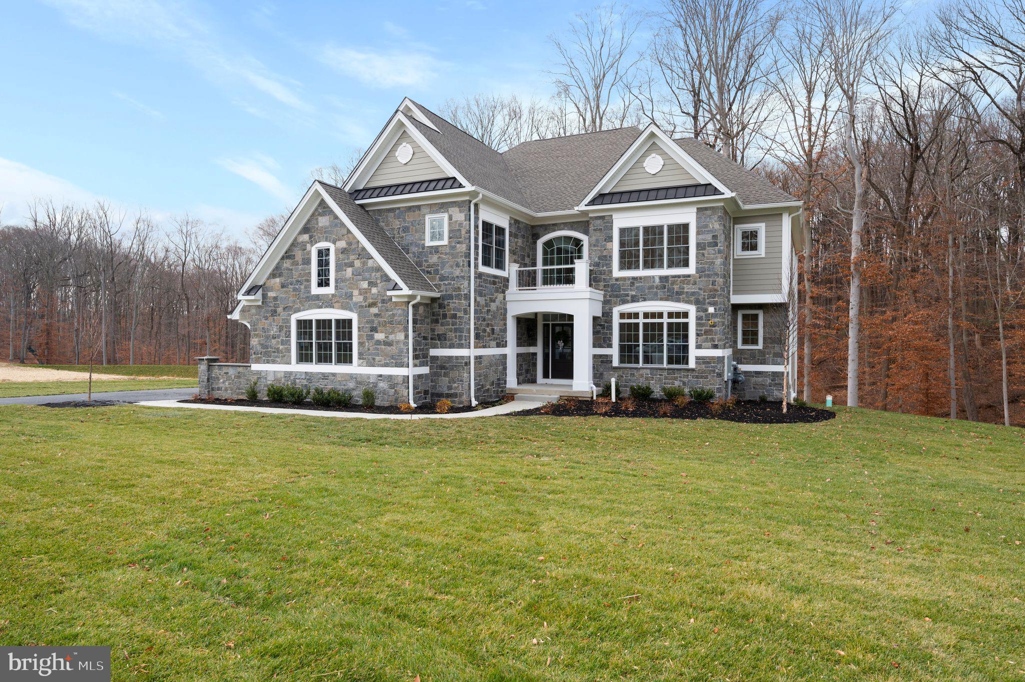 The well-designed Bellflower Model offers smart architecture for easy entertaining and everyday living with a long list of included appointments such as Real Stone & James Hardie Sided exterior elevations, Pella windows, rich interior moldings, wide engineered hardwood floors, side sweeping main staircase, solid interior doors, insulated interior walls, finished Lower Level with Den or Bedroom, daylight windows, walk out entrance and full Bathroom and the list goes on!!  
Step into our Foyer and be welcomed with beautiful windows and natural light!   Once inside, the Dining Room will delight you with its sophisticated tray ceiling and adjoining Butler's Pantry with glass front cabinets, ready to be the serving station for your next get together!  The Gourmet Cook's Dream Kitchen will WOW you with an expansive 10’ Arched Center Island, Tall Painted Cabinets with Crown Molding to the Ceiling, Undercabinet LED Lighting, gleaming Quartz Countertops, equipped with the Thermador Stainless Steel Appliance Package, including Double Wall Ovens, Built in Microwave Oven, Stainless Steel Dishwasher, 5 Burner Gas Cooktop, Stainless Steel Hood, all overlooking a cozy Breakfast Room with a rear glass wall.   On game day, your friends & family will enjoy watching their favorite team in the adjoining Two-Story Family Room, with a handsome fireplace and window wall.   The First Floor also features a Guest Suite or Home Study with a large Walk-In Closet and Dual Access Full Bathroom.  In addition, there is a convenient Mudroom Hall giving access to a Covered Outside Entrance, Three Car Garage, Coat Closet, and an Additional Walk-In Closet sized for a possible Future Elevator.    The Second Floor offers a great design with a dramatic Balcony leading to the luxurious Owner’s Suite with a Bay Window looking onto the Rear Grounds, Volume Tray Ceiling, Dual Walk-In Closets, and a Spa Bathroom Retreat with a Free-Standing Soaking Tub, Spacious Shower with Frameless Shower Door and separate Wall Vanities.  Three additional generously sized Bedrooms, Two Full Bathrooms, an abundant Linen Closet and a conveniently located Laundry Room outfitted with Cabinets and Utility Basin complete this level!   Please note the Total Square Footage includes over 1,500 square feet of Lower-Level Finished Space with a Full Bathroom, Storage Closets, Daylight Windows, Walk-Out Entrance to a Garden Patio.   We are Open by Appointment only, so please call for details and to schedule your tour!  Public Water, Public Sewer, and Natural Gas.  Photos are of the model home and may show options.