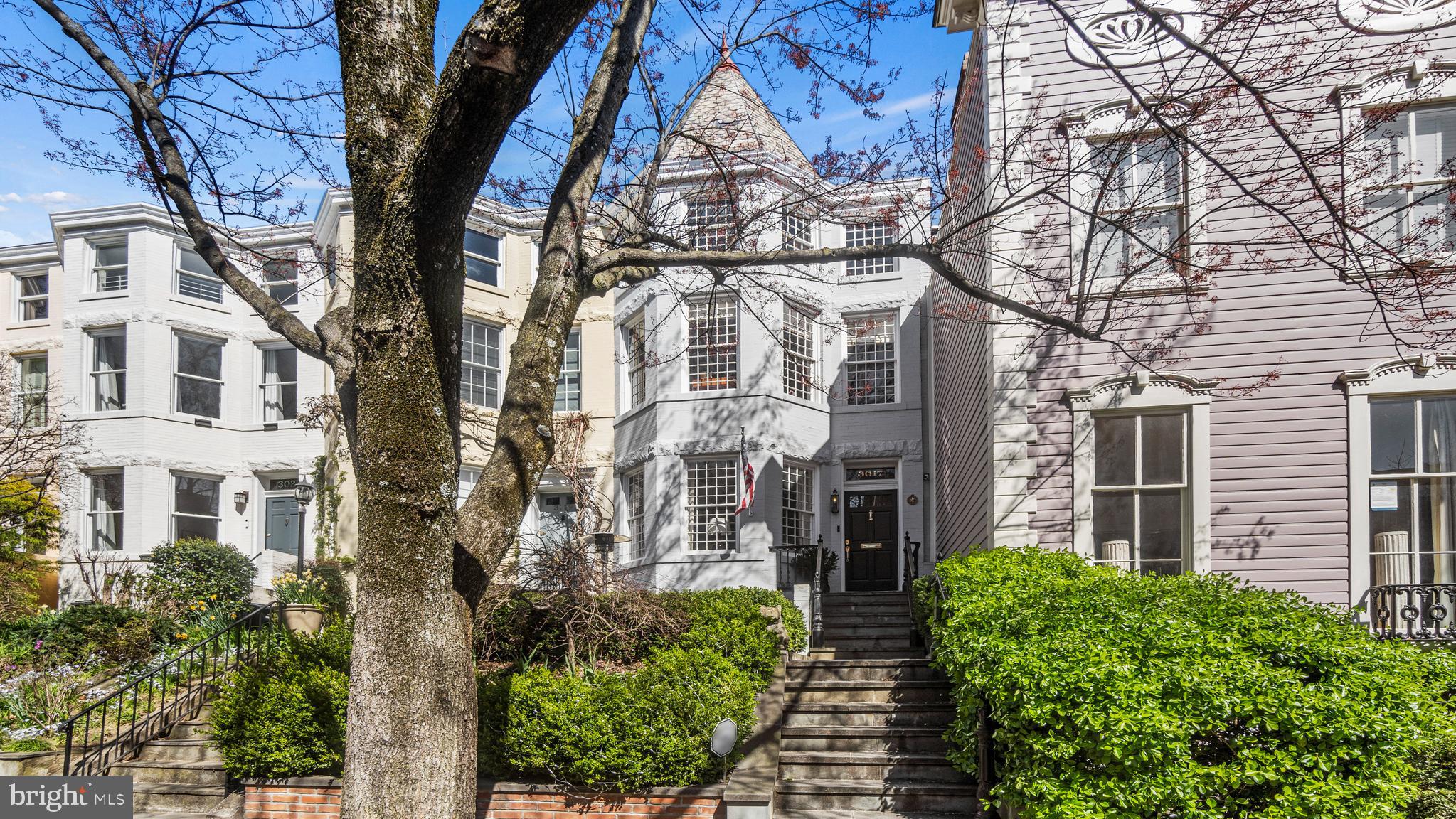 Carefully renovated and expanded over the years, this 4-bedroom, 4-bathroom East Village Victorian offers three levels of gracious, light-filled living space. Ideally situated on the quiet one-way street of Dumbarton, you'll be charmed by the beautifully landscaped front walk-up offering a street-facing patio. Highlights throughout the home's interior include hardwood floors, high ceilings, three new gas fireplaces, and a recently updated kitchen with a center island opening to a generous family room which enjoys direct access to the rear patio. 

The expansive primary suite features a fireplace, walk-in closet, and updated marble tile bathroom with soaking tub, steam shower, and dual vanity. Bedrooms 2 and 3 share an updated hall full bath, and stackable washer/dryer completing the second level. While the lower level with separate rear access includes a versatile family room, exercise room, full kitchen, full bath, and bedroom 4. The private hardscaped patio with electric gate can double as a parking pad.