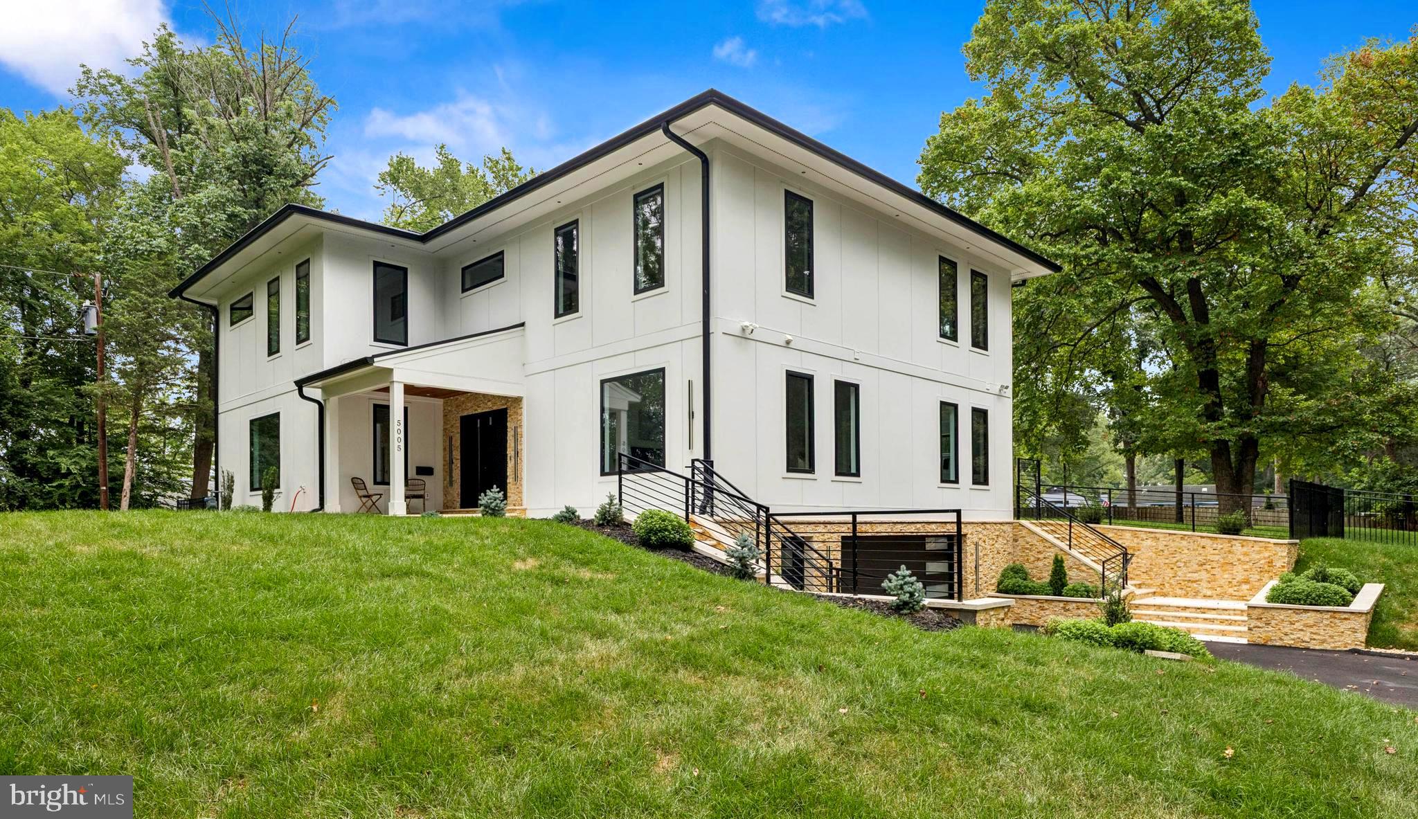 2 Appraisals Attached to this listing at $2.150,000 (07/24) and $2.180,000 (01/25)
Custom-crafted urban manor, blending Modern Prairie and Scandinavian Contemporary design, rests on a lush 1.25-acre wooded oasis. Perfectly positioned near key amenities and travel routes, this brand new home offers tranquility, convenience and style. 
Enter a grand family room with 19-foot ceilings and expansive floor-to-ceiling windows, where natural light streams in framing inspiring views of the surrounding landscape. The gourmet kitchen features striking marble countertops and backsplash, premium Café appliances, and a butler’s pantry with farmhouse-chic rolling door. This space flows into a formal dining room and a bright breakfast nook overlooking the new vinyl pool and meticulously landscaped grounds. The main level includes a luminous in-law suite, while the upper-level master suite, inspired by nautical elegance--appearing to overlook a sea of perfect green--offers a private retreat. Each bedroom features custom Pax closet systems and full baths with refined marble finishes. A versatile loft overlooking the main level serves as an ideal space for children’s homework or play. The fully finished lower level, accessible via a single silent garage bay, houses an entertainment center, wine room, and a guest bedroom with a full bath, perfect for an au pair or live-in nanny. Additional features include travertine stairs, walkways, patio, and pool area; a new paved driveway for up to 12 cars; durable Hardie Plank exterior; and energy-efficient L.E.D. lighting. Schedule your private tour today. Twin Car charging stations at the garage. CAT5 in every room.
