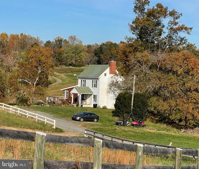 This extraordinary 156+/-acre estate presents a unique opportunity to own a piece of Virginia's countryside paradise.
Encompassing two separate parcels, the property boasts many uses. A captivating stream winds its way through both parcels, adding to the tranquility and natural beauty of the land. This stream is more than abundant for livestock. 
The 1848 farmhouse itself embodies a practical and unpretentious spirit.  Featuring 2 bedrooms and 1 ¼ bathrooms, it offers a comfortable and functional living space. There is an updated bathroom  with radiant heat flooring.  Hardwood floors adorn most of the living space. The renovated sun porch with ceramic tile provides a spot to relax and savor the views.  The expansive wrap-around deck invites you to enjoy the peacefulness of the countryside, perfect for entertaining or simply soaking in the fresh air.
The  101+/- acres  offers a  functional 5-bay garage providing ample storage for equipment, vehicles, or hobbies, while the unfinished living space above the garage holds incredible potential for expansion.   A 
 solar self sustaining greenhouse allows you to cultivate year-round, and several farm buildings ensure your operation is well-organized.
Here's a glimpse of the exciting possibilities:
......Cultivate a thriving farm: With ample space and fertile land, raise livestock, grow crops, or establish an equestrian facility.
.....Create a secluded sanctuary: Immerse yourself in nature and unwind in the tranquility of your own private retreat.
.....Explore development opportunities (subject to zoning approval).
 With two separate parcels, you can explore various ownership options, creating a multi-generational estate or crafting the perfect investment portfolio. (Always check with zoning regulations before subdividing.)
This remarkable property offers a blank canvas to bring your dreams to life. Schedule a showing today and discover the possibilities!
****Please note: The property is offered "as-is". More photos and aerial views to follow soon.
NO DRIVE BYS....APPOINTMENT ONLY!