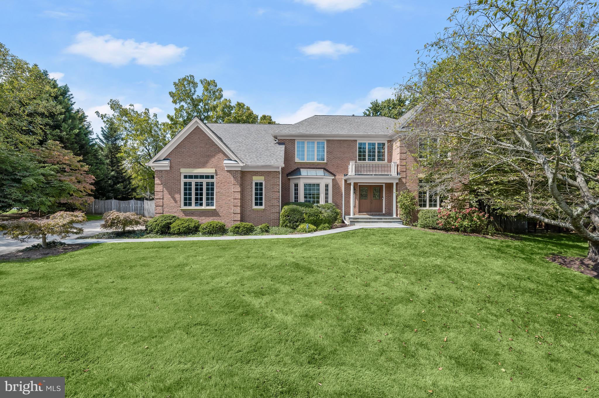 Situated on a quiet, tree-lined street in the friendly Roberts Glen neighborhood of Potomac, 11700 Becket Street presents traditional design notes perfectly balanced with modern amenities. Built in 2000, this stunning Colonial offers 4 Bedrooms, 4 Full Baths, and 1 Half Bath across 3 Levels and 6,356 square feet of elegantly curated living space, including Main and Upper Level hardwood floors, recessed lighting, crown molding, and chair railings.

This residence boasts a large, verdant front lawn and a handsome slate front walkway, lined with manicured landscaping. Upon entering the dramatic 2-story Foyer, residents and guests alike will admire the elegant chandelier and pillars leading to the Living Room. The Living Room presents triple crown molding, a wood-burning fireplace with brick hearth and surround and a wood mantle; settle in for the colder seasons in this comforting space. Through classic French doors the Office awaits, boasting a beautiful bay window; find focus in this room designed for inspiration and productivity. The Dining Room showcases a brass chandelier, wainscotting and double doors leading to the Butler’s Pantry. The Gourmet Kitchen will be sure to delight any at home-chef, complete with granite countertops, a large island with breakfast bar seating, updated appliances, a walk-in pantry and a Breakfast Area with a chandelier and idyllic view of the Rear Yard. The tasteful Butler’s Pantry boasts a new Hisense wine cooler, glass front cabinetry and French doors leading to the Rear Porch with stairs to the Pool Deck and Rear Yard. The Family Room showcases a cathedral ceiling, a gas fireplace with marble hearth and surround and a wood mantle, a lighted ceiling fan and a rear staircase leading to the Upper Level. The Main Level is complete with a Mud Entry with garage access, an alcove closet area and a Powder Room with a pedestal sink and vanity lighting.

Ascending to the Upper Level, the luxurious Primary Bedroom Suite awaits, offering a spacious Bedroom with tray ceilings, a crystal chandelier, pillars separating the Bedroom and Primary Sitting Room, 2 walk-in closets and an ensuite Primary Bath. The spa-like, ensuite Primary Bath showcases tile flooring, a stall shower with tiled flooring and surround, a jetted tub, a dual vanity with Corian countertops, vanity lighting, mirrored medicine cabinets, a linen closet, tray ceilings and a separate water closet; enjoy well-earned pampering in this soothing oasis. The Second Bedroom offers a crystal chandelier, a walk-in closet and an ensuite Full Bath with tile flooring, a single vanity and a tub shower with tile surround. The Third Bedroom, complete with an outfitted closet and crystal chandelier, and the Fourth Bedroom, complete with a walk-in closet and glass chandelier, share a Jack-and-Jill style Full Bath that includes tile flooring, a single vanity, and a separate room with a toilet and tub shower with tile surround. The Upper Level is complete with a Hall linen closet and a large Laundry Room with a utility sink, shelving and a washer and dryer.

Descending the carpeted staircase to the newly renovated Lower Level, the Recreation Room offers a wet bar and an adjacent, sizable unfinished storage closet. This Level also offers an Exercise Area, a Gaming Area, a spacious, unfinished Room for extra storage or a potential Movie Room, and an optional Office/Bonus/Guest Room with a closet and attached Full Bath, also accessed from the Recreation Room; featuring new LVP flooring throughout and a room for every activity, the Lower Level’s opportunities are endless!

The Rear Yard is highlighted by an in-ground pool, perfect for hosting the annual summer pool party.

In close proximity to local parks, Cabin John Village, Potomac Village, Country Glen Swim and Tennis Club, Wayside Elementary, Herbert Hoover Middle School, and Winston Churchill High School, 11700 Becket Street offers the opportunity to make countless new memories in a one-of-a-kind home!