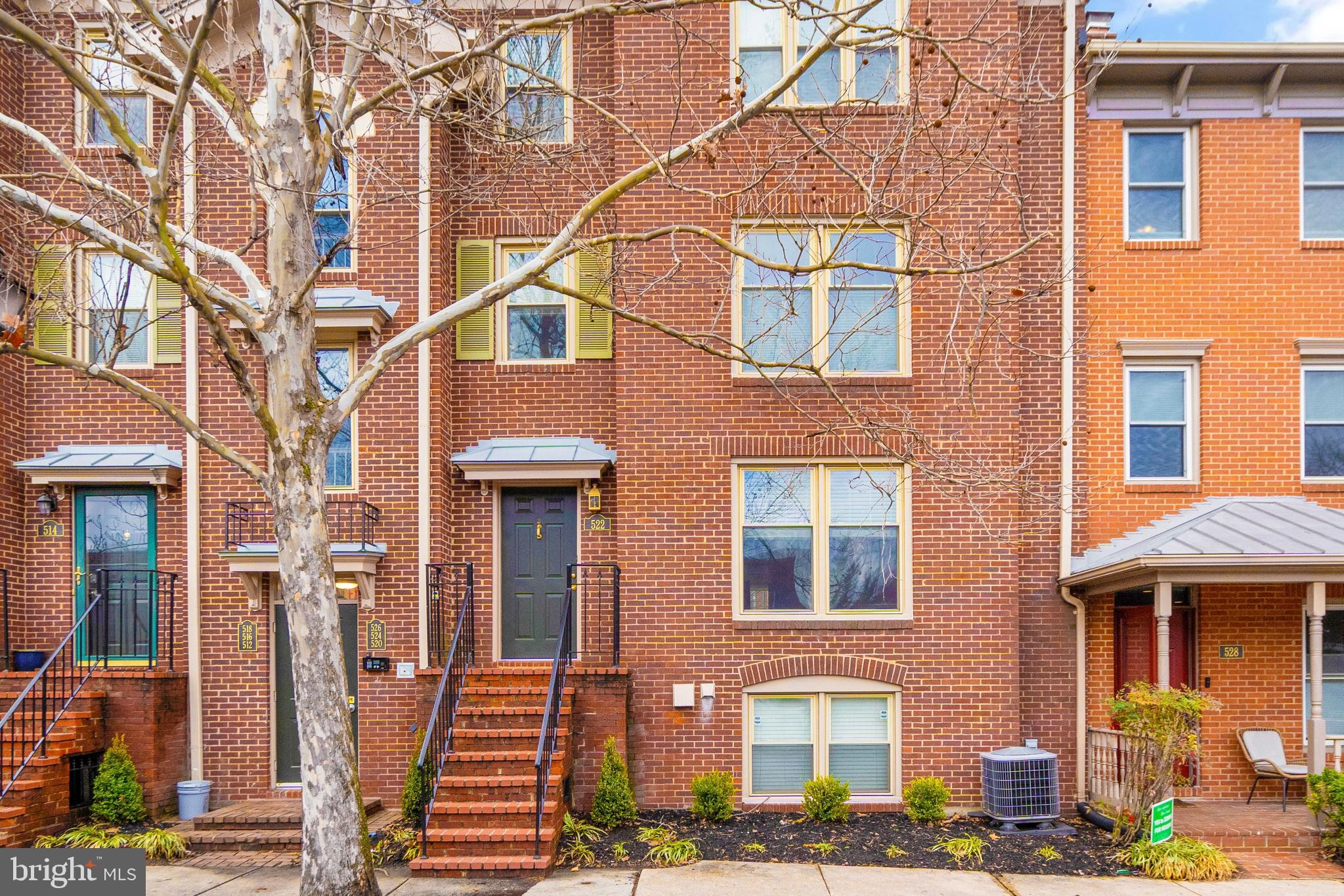 Welcome home to this townhome-style 2-bedroom condo with parking! Offering a private entrance for ease of access, a decorative wood-burning fireplace and vinyl wood floors in the living area, and a spacious patio for outdoor relaxation. Fresh paint and new carpet in the bedrooms create a clean, inviting atmosphere, while updated lighting adds a modern touch. The kitchen features stainless steel appliances, granite countertops, and floating shelves. The bathroom had a recent facelift with a new mirror and light fixture. No more trips to the laundromat with the in-unit washer and dryer and there's tons of closet space for all your belongings. Amazing location in the Colecroft community, close to Braddock Metro, Trader Joe's, Old Town, and Del Ray. Walk to nearby favorites like Dos Amigos, Bastille Brasserie, and Starbucks. Colecroft is pet-friendly. Don't miss out on this cute and convenient home!