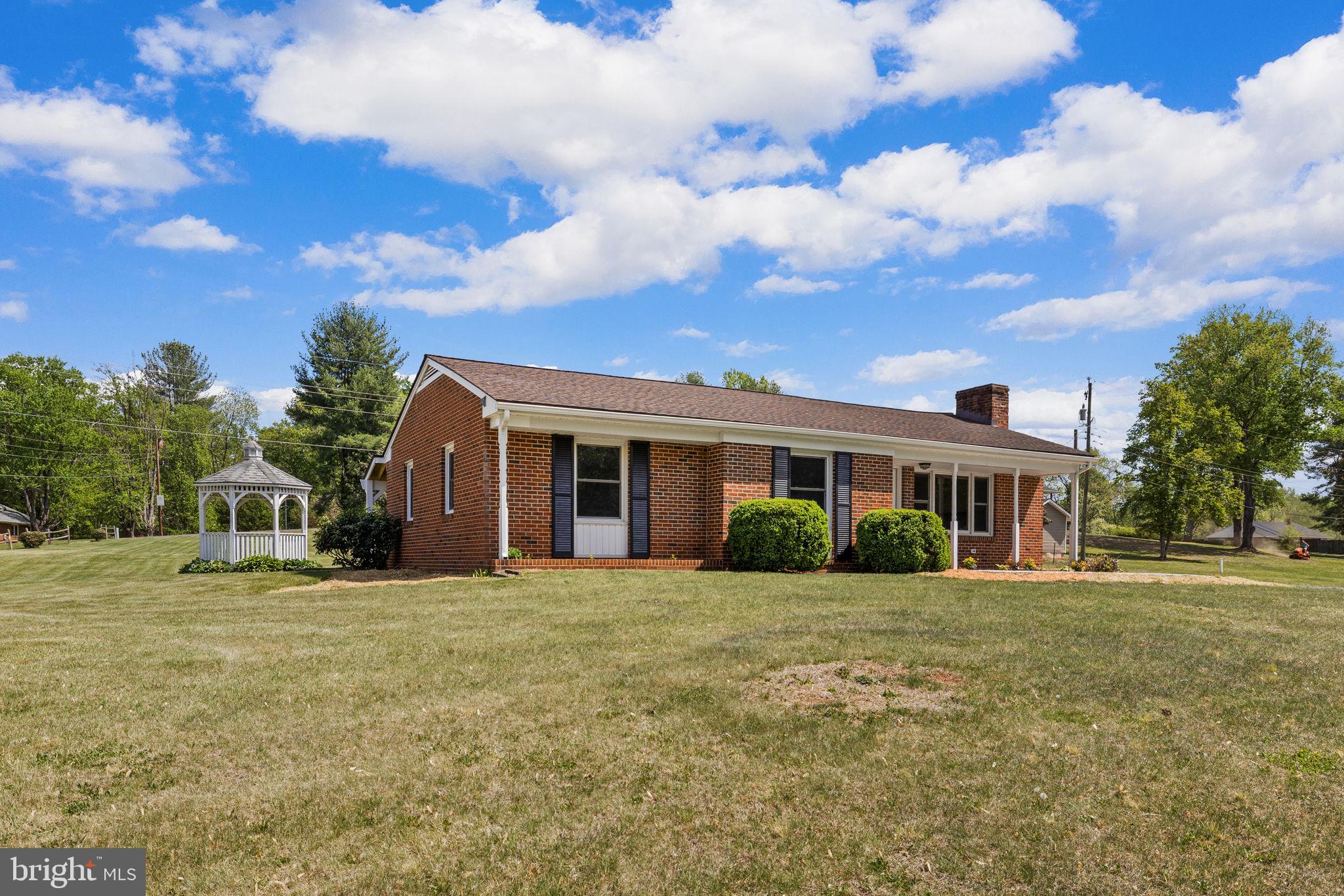 Completely reimagined from top to bottom, this beautifully renovated all-brick home offers the perfect blend of classic charm and modern upgrades—all on one convenient level with a full basement! Featuring approximately 1,282 square feet on each level, this home provides plenty of space to live, work, and entertain. Step inside to discover a fully gutted and thoughtfully remodeled interior, showcasing brand-new finishes, updated systems, and a fresh, modern feel throughout. The main level offers easy, one-level living, while the full basement provides endless possibilities—whether you need additional living space, storage, or a workshop. Enjoy peaceful mornings or relaxing evenings on the inviting covered front porch, or your own gazebo perfect for taking in the quiet surroundings.Ideally located near James Madison’s Montpelier, this property offers a blend of history, charm, and convenience with easy access to the town of Orange and surrounding areas.
Whether you’re looking for a primary residence or a charming retreat, this move-in-ready home is a must-see!