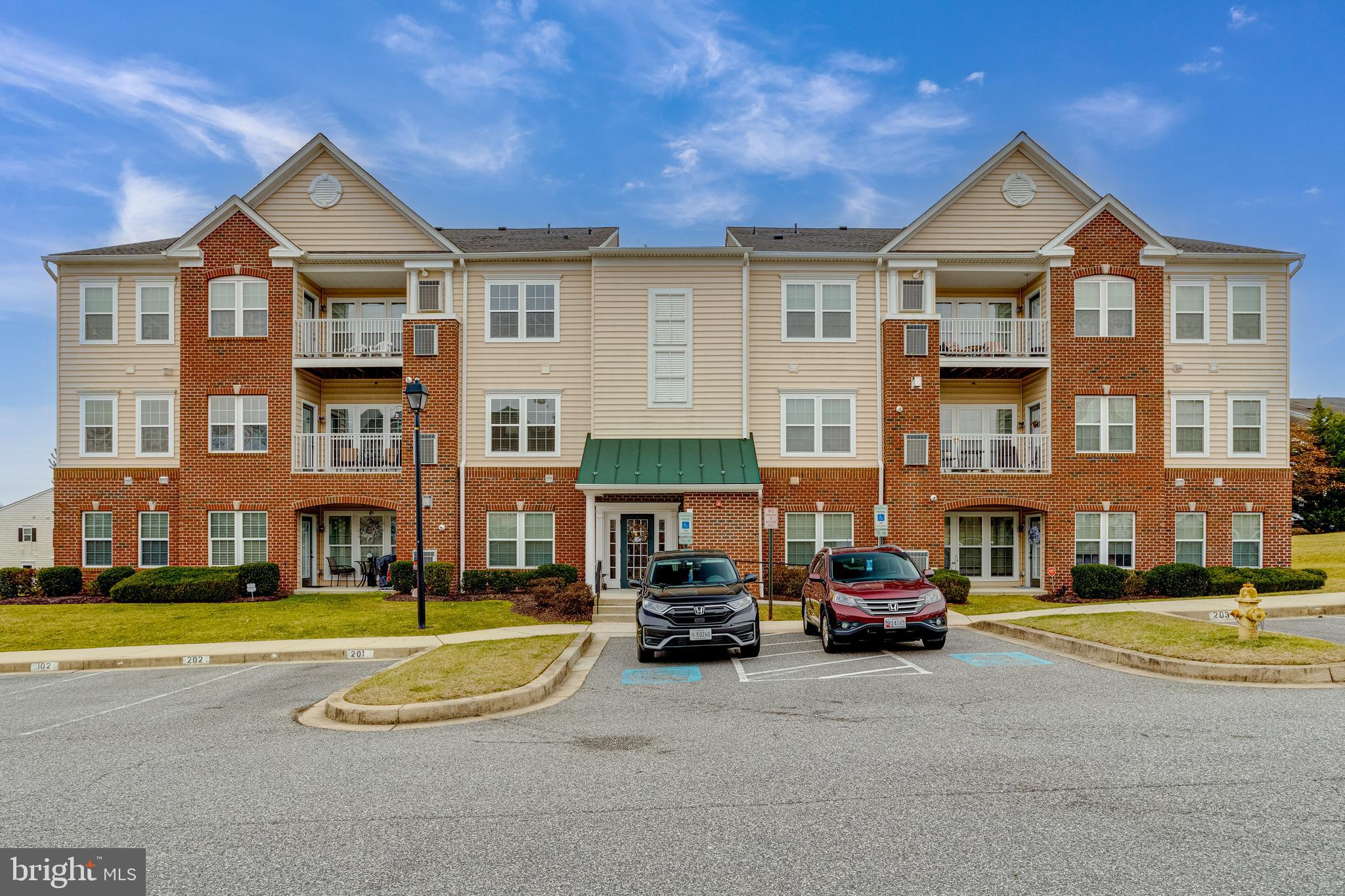 Stunning 2nd floor unit in Monmouth Meadows! Spacious open floor plan featuring 2 bedrooms PLUS a den. Enter at foyer entrance with plenty of closet space. Open to dining and living room, this area is dressed in crown molding. Dining features chair to further accent the table space. From the living room, the open access to den highlighted with column entry and pass through to kitchen spotlights the space within this floor plan. With three windows in the living room and two windows in the den, the living space is flooded with natural daylight. Kitchen with 42" cabinets, stainless steel appliances, granite counters, and finished with a beautiful backsplash. A laundry closet is conveniently tucked in the kitchen area. Den with ceiling fan and access to balcony.  Primary suite features a bedroom with ceiling fan, plenty of closet space, and a full bath with shower and single sink with vanity area. 2nd bath with ceiling fan and plenty of closet space.  A hall bath offers a full tile surround at the tub/shower combo and a linen closet.  The balcony overlooks the community area at front.  This sundrenched unit showcases pride of ownership and upgraded features throughout. Monmouth Meadows is conveniently located near countless restaurants, stores, parks & recreation and is easy to access from I-95.  Enjoy maintenance free living in a community that offers countless amenities that include a club house, exercise room, and a pool. Schedule your private tour TODAY!