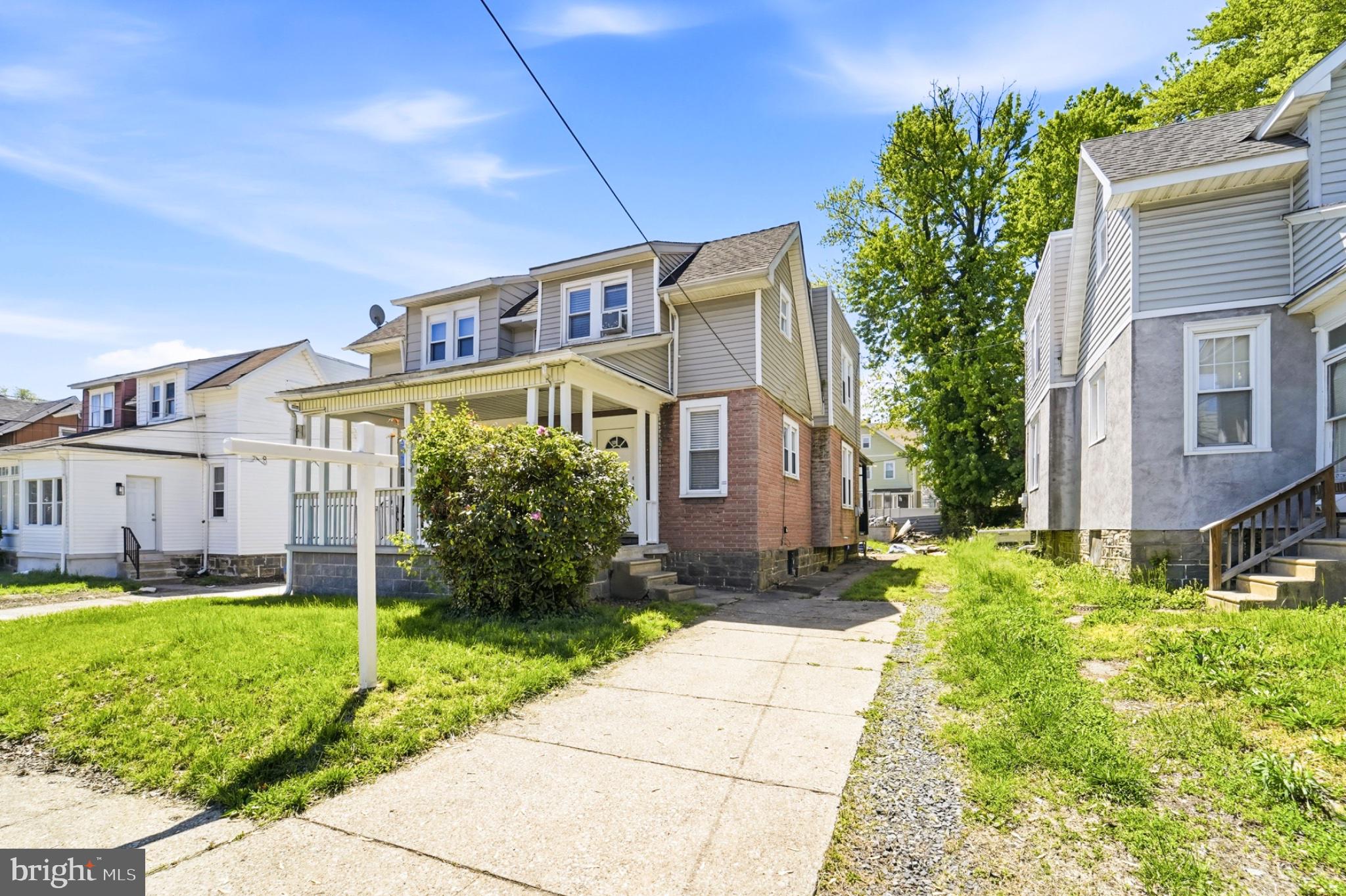 Welcome home!  This twin home is nestled on a culdesac block, with a private driveway that can fit at least three cars with ease, a front and rear covered porch, and a huge, fenced back yard.  The front door ushers you into the first floor that's newly renovated with new flooring, ceiling fans/lighting, newly installed window treatments, and fresh paint.  The kitchen tile is newly installed, and a brand new gas stove.  Original hardwood steps lead to the 2nd level where the new floors and fresh paint continues throughout the hall and bedrooms; and a newly renovated full bathroom.  There is a full basement with inside and outside access, and endless possibiities to make it your own. Also included is a newer hot water heater, newer heating system, and two AC  window units.
