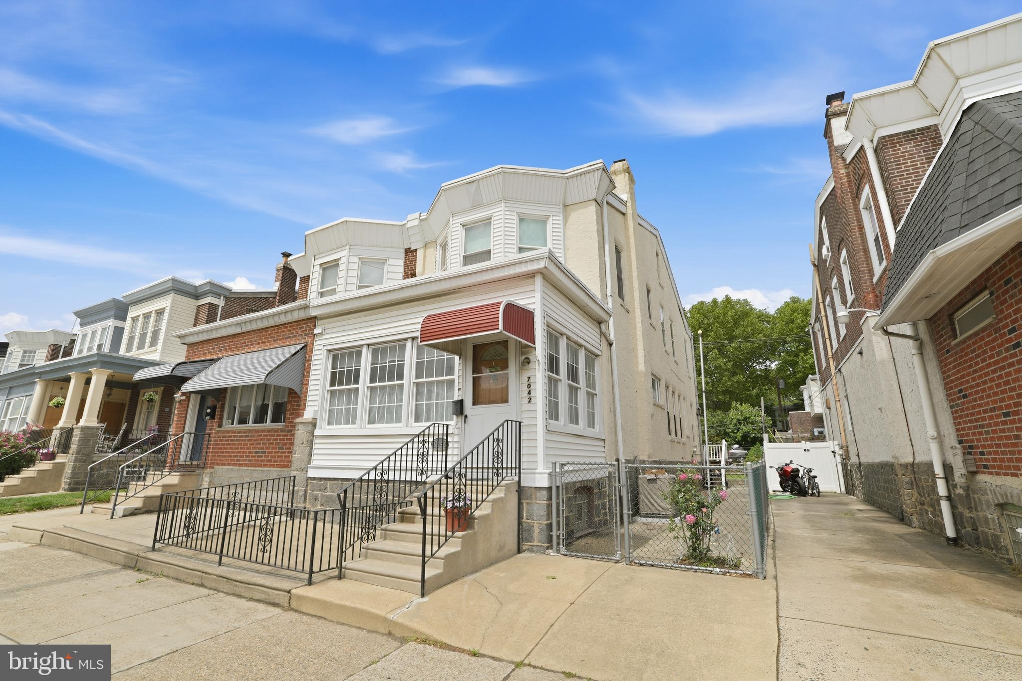 Beautifully maintained and full of character, this spacious home in the historic Tacony neighborhood blends timeless charm with everyday comfort. Start your mornings on the inviting covered front porch enjoying the sunrise, then unwind in the evening on the rear deck with peaceful sunset views. Inside, high ceilings and a roomy layout create an airy feel throughout the large living room, formal dining room, and eat-in kitchen. A rare feature of the home, two separate staircases lead to the second floor where you’ll find three generously sized bedrooms and a full bath. The walk-up attic provides excellent additional space and could easily serve as a home office, playroom, rec room, or additional storage area.
 This well-built home showcases historic details and old-world craftsmanship while offering modern conveniences including central air, one full bath, and two half baths — including one on the main floor and another in the semi-finished basement. The basement also provides additional living or recreation space along with abundant storage. Hardwood floors through out the home under the carpets. 
Conveniently located close to public transportation, shopping, schools, parks, dining, and major roadways, this unique Tacony gem offers character, space, and practicality all in one. Don’t miss the opportunity to update and personalize this classic home to reflect your own style and vision.