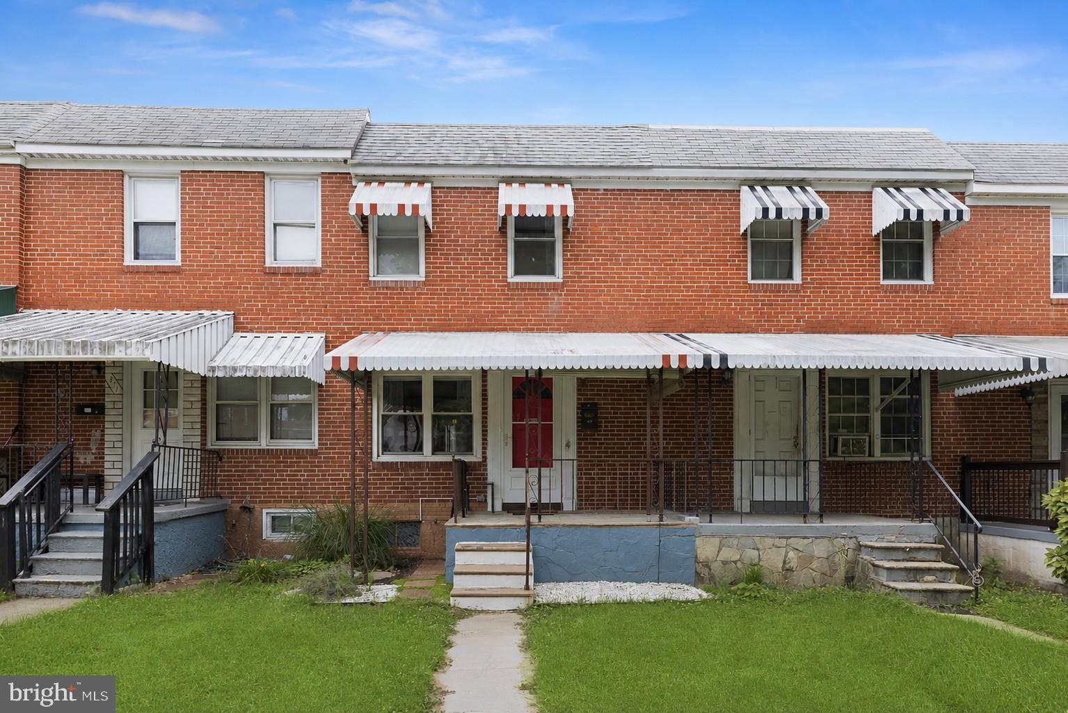 Welcome to this thoughtfully renovated three-bedroom brick rowhome in Essex, MD, where stylish updates and thoughtful improvements create a home that is truly move-in ready. An awning-covered flagstone front porch provides a warm welcome and leads into the open-concept main level.
The sunny living room features rich hardwood flooring and a pleasing neutral color palette, creating an inviting space to relax and unwind. Hardwood flooring continues through the graceful arched entry into the dining area, highlighted by decorative pendant lighting and a convenient standalone pantry for additional storage.
The well-appointed galley kitchen showcases stainless steel appliances, including a gas range, a mosaic tile backsplash, and direct access to the newer deck. Complete with a beautiful pergola, this outdoor living space is perfect for dining al fresco, entertaining guests, or simply enjoying a quiet evening outdoors. The powder room completes this level. 
Upstairs, the tranquil sleeping quarters include a spacious primary bedroom, two additional bedrooms, and rich hardwood flooring throughout. The renovated full bath is enhanced by a skylight that fills the space with natural light, while the recently reglazed tub and shower provide a fresh, updated finish.
The finished lower level expands the home's living space with a recreation room featuring durable wood-inspired luxury vinyl plank flooring and track lighting. Whether used as a music studio, private home office, media room, or gathering space for game nights, this flexible area adapts to your lifestyle. Just beyond, the utility room includes a workbench, making it the perfect space for hobbies and DIY projects.  The partial bathroom finishes this flexible lower level.  
This home has been thoughtfully updated with numerous value-added improvements, including a newer water heater (2023), deck and pergola (2024), new natural gas lines (2025), professional landscaping completed in the summer of 2025, air conditioning maintenance and cleaning (June 2026), a new HVAC condensate pump (2026), and a resealed roof (2026). Security system equipment is already installed, allowing the new owner to simply activate service by creating their own monitoring account.