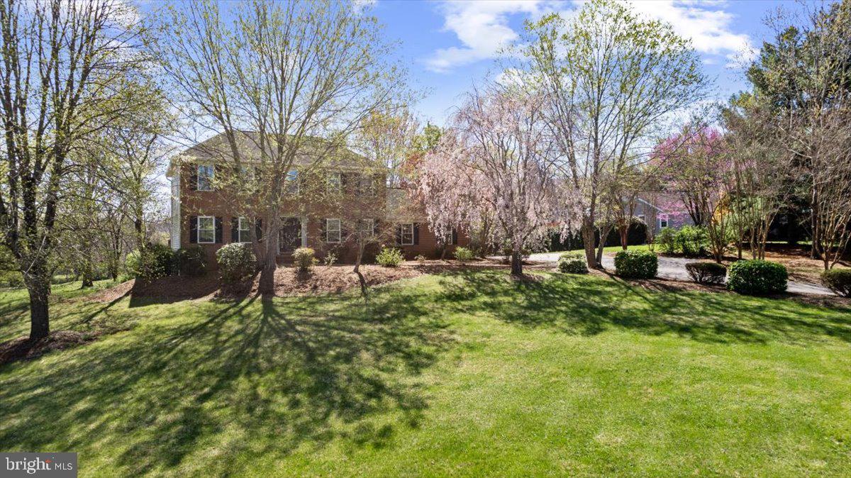Welcome to 19103 Edgehill Place, Culpeper's sought-after Clairmont Manor community. This charming and spacious home sits on over 3.5 acres of gently rolling, open land with blooming trees and a peaceful pond—ideally enjoyed from the expansive back deck, ideal for relaxing or entertaining.  For all you dog lovers, there is an electric fence. 
Inside, the home offers five bedrooms, three full baths, a main-level home office equipped with Comcast cable or Xfinity internet, and a large walk-out lower-level rec room—providing flexible space for entertaining, guests, or family living. The home features updated bathrooms, fresh paint, modern lighting, new carpet, and storage, from garage built-ins to primary bedroom walk-in closets.  The kitchen includes newer appliances, and you’ll also find a newish washer and dryer on the lower level, windows, gutters, and an HVAC system —giving you peace of mind and energy efficiency.
Take in the gorgeous backyard scenery from the kitchen, dining area, and family room—each thoughtfully designed to capture the natural beauty just outside. The family room features a cozy gas fireplace, perfect for relaxing evenings at home. A versatile main-level office is ideal for working remotely, homeschooling, or enjoying a quiet reading retreat.  It's conveniently located just minutes from Routes 29 and 15, an hour from Charlottesville and just over an hour from Washington, DC, making commuting or weekend getaways a breeze.  This home blends country charm, modern updates, and a perfect location—all in one of Culpeper’s most desirable neighborhoods.