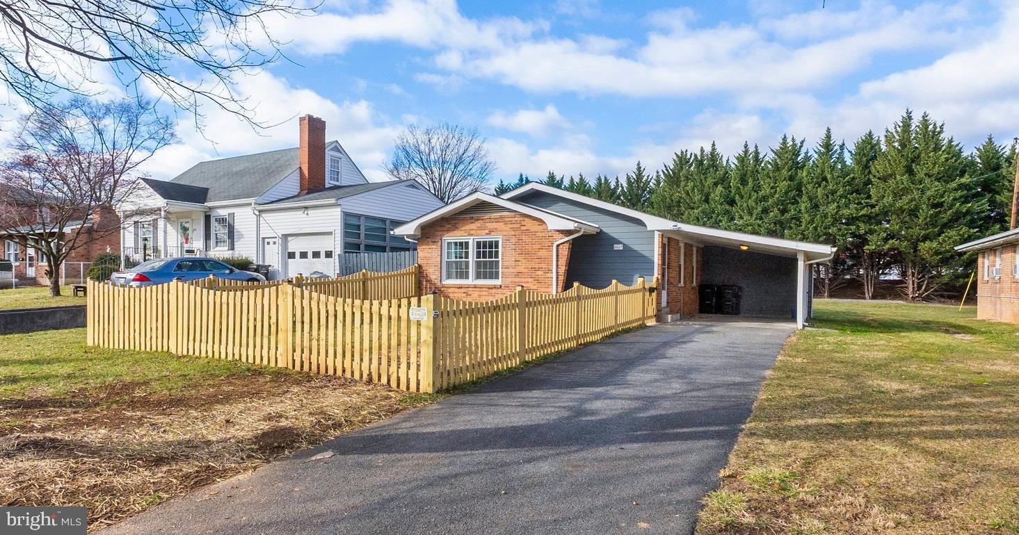 Welcome to 2227 Wilson Boulevard, where mid-century meets 2024!  The home has been fantastically updated with brand new HVAC, roof, gutters, windows, paint, kitchen cabinets, countertops, appliances, a new bathroom and more!  Plenty of parking including a covered carport. Enter into the brand new kitchen with modern cabinetry, stainless steel appliances and granite countertops. Find a lovely opening into the spacious living room. The upper level offers 3 bedrooms and an updated full bathroom with subway tile. The lower level offers endless possibilities for storage or expanding living space. Situated on a huge lot with a flat and level backyard. Located minutes from all things shopping, restaurants, schools and more.