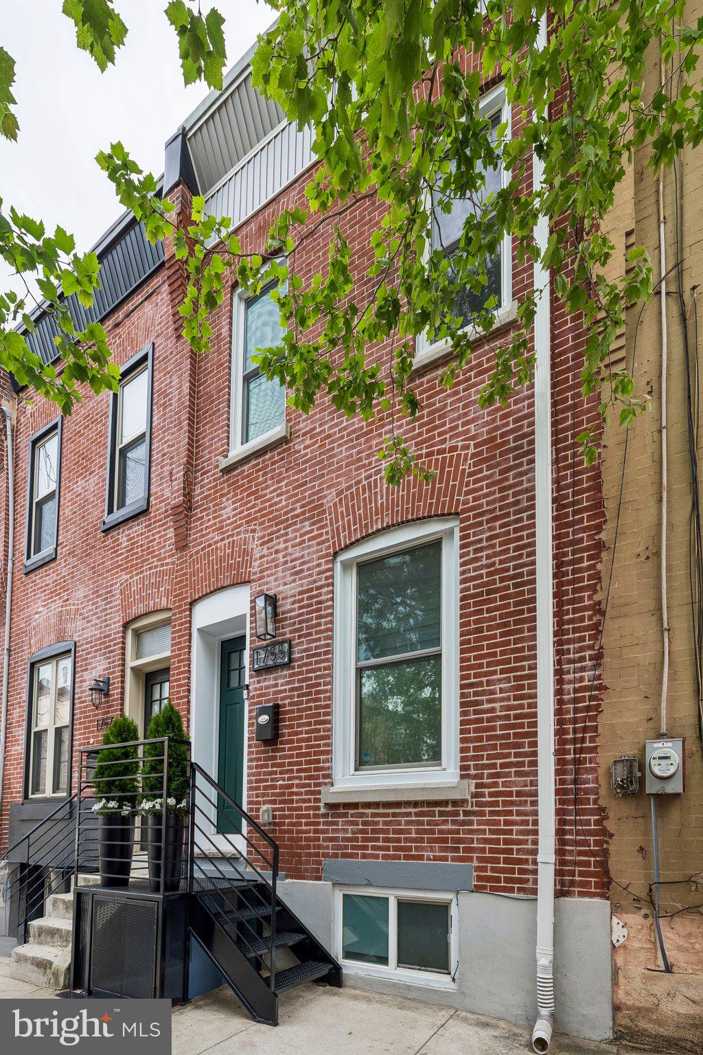 **Enjoy the massive benefit of a TAX ABATEMENT THROUGH 2030**  Welcome to 1755 N 26th St, a stunning, fully renovated home tucked away on a quiet block in Brewerytown, one of Philadelphia’s most vibrant and fastest-growing neighborhoods. This 4-bedroom, 4.5-bath residence seamlessly blends modern comfort with timeless character, featuring custom wood beams, exposed brick, and thoughtfully curated design details throughout. The open main level offers a bright, spacious living area that flows effortlessly into the dining space and into a beautifully designed kitchen complete with custom cabinetry, upgraded appliances, and striking countertops. A conveniently located half bath completes this level. Upstairs, the second floor features two generously sized bedrooms and two fully updated, stylish bathrooms, along with a conveniently located laundry area. The third-floor primary suite serves as a true retreat, boasting a massive bedroom, an oversized walk-in closet, and a private en-suite bathroom. The fully finished basement provides incredible flexibility for additional living space, whether you envision a media room, home office, gym, or recreation area. Ideally located just 10 minutes from the Philadelphia Zoo and Art Museum, a short six-block walk to Girard Avenue, and only 15 minutes to Center City, this home offers both convenience and lifestyle. This is a rare opportunity to own a high-quality renovation in one of Philadelphia’s most sought-after communities. Take advantage of an active and approved tax-abatement until 2030.