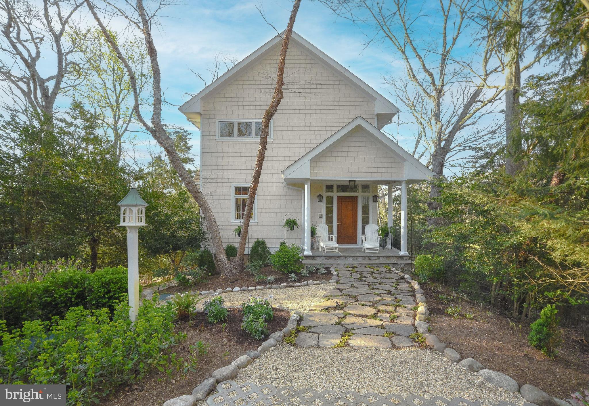 This Acorn built home, featuring post and beam construction, is nestled on three acres of privacy on St Thomas Creek, within minutes of the Patuxent River and Solomons Island. The open-concept design features a gourmet kitchen with downdraft range, warming  drawer, spacious pantry and center island. 10 foot ceilings on main level. Every room offer a view of natures beauty including the creek. First floor den/bedroom includes full bath and 3 skylights. The spacious Sunroom facing the water features triple pane Pella windows with built-in room darkening shades allowing a conversion to the home theatre. The hidden 110 inch wide screen lowers and raises by remote control. The high-definition video projector is hidden in the back wall and viewers are surrounded by 7-channels of audio. The Sunroom also features one of the homes three fireplaces! Upper floor offers the Primary Suite with a deluxe Ensuite featuring soaking tub with built in TV, his and her vanities, separate shower and skylights. A sitting room is attached with more views of the wonders of this location. The Primary  features cathedral ceilings and a walk-in closet. The second level  also offers two additional bedrooms and a hall bath.  Unfinished basement with rough-in and windows awaits your imagination but features a large screened porch with  gas fireplace attached to enclosed garden to protect your special plants. A 60 foot pier and connecting stairway were built in 2016 allowing for two boat slips and a lower platform for easy access to launch a kayak. This home is well appointed: Pella windows, nine skylights, three fireplaces, hardwood floors, recessed lighting, intercom throughout, lighted driveway professionally landscaped, serviced by in-ground irrigation and a matching shed. Come and enjoy the peaceful and serene lifestyle this home offers!!!