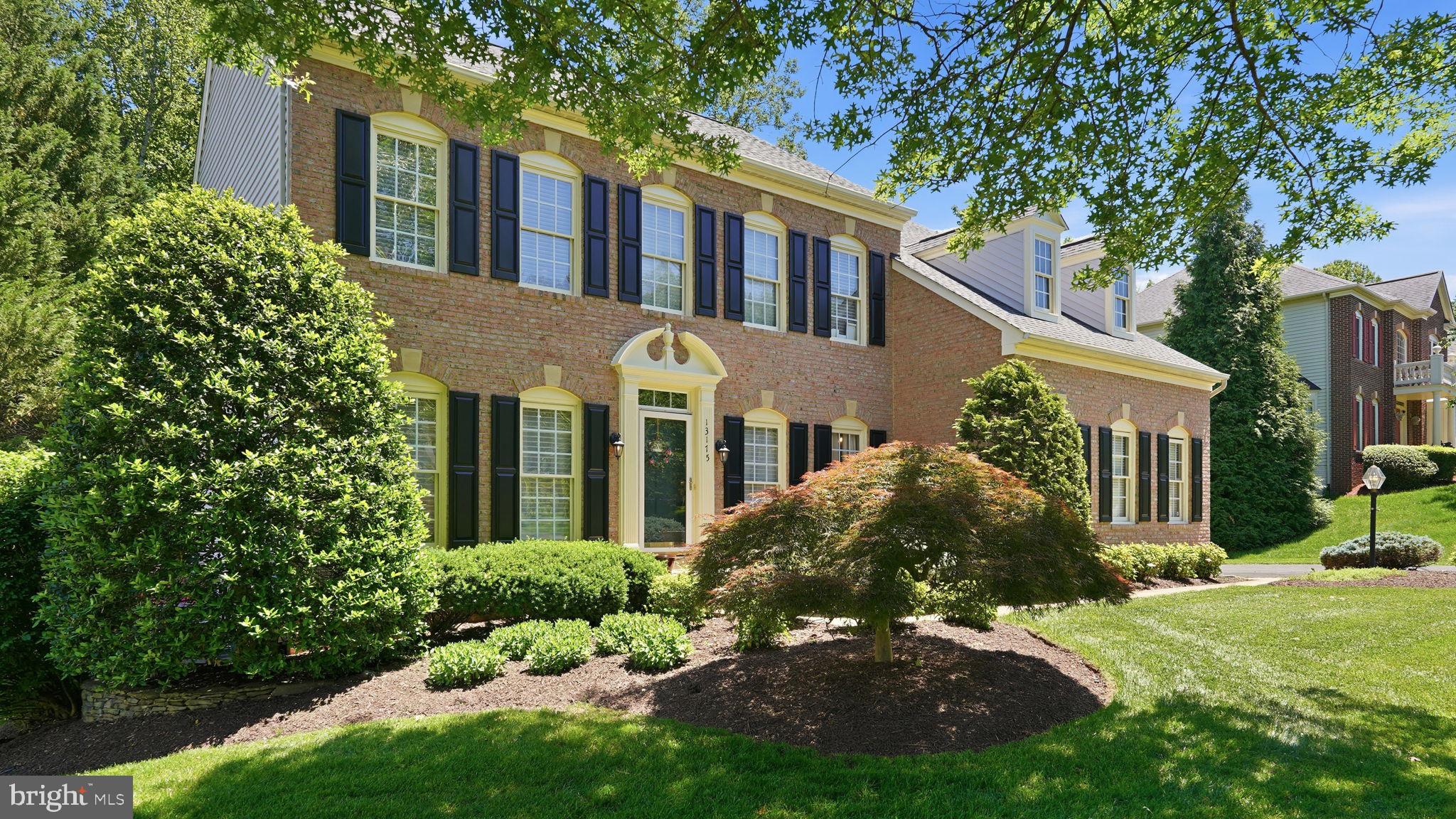 Nestled on a picturesque, nearly half-acre homesite backing to a serene tree lined backdrop, this exceptional 5-bedroom, 3.5-bath residence offers the perfect balance of luxury, comfort, and privacy.

From the moment you enter, you'll be captivated by the gleaming hardwood floors, spacious open layout, and abundant natural light. The heart of the home is the beautifully appointed gourmet kitchen, featuring a center island, ample cabinetry, and seamless flow into the sun-drenched breakfast room where soaring ceilings and walls of windows showcase views of the surrounding trees. The adjoining family room provides an inviting space for gathering, entertaining, and everyday living.

Upstairs, the expansive primary suite serves as a private retreat, complete with a spa-inspired bath featuring dual vanities, a soaking tub, and separate shower. Generously sized secondary bedrooms offer comfort and flexibility for family and guests alike.

The finished walkout lower level extends the home's living space with a large recreation room, private office, fifth bedroom, and full bath—ideal for multi-generational living, overnight guests, remote work, or a personal fitness area.

Step outside and discover your own backyard sanctuary. A spacious deck, and multiple patio spaces create the perfect setting for outdoor entertaining, peaceful mornings, or relaxing evenings surrounded by nature.

Offering a rare combination of privacy and convenience, this remarkable property is just minutes from shopping, dining, parks, and major commuter routes. A truly special opportunity to enjoy refined living in an exceptional setting.
