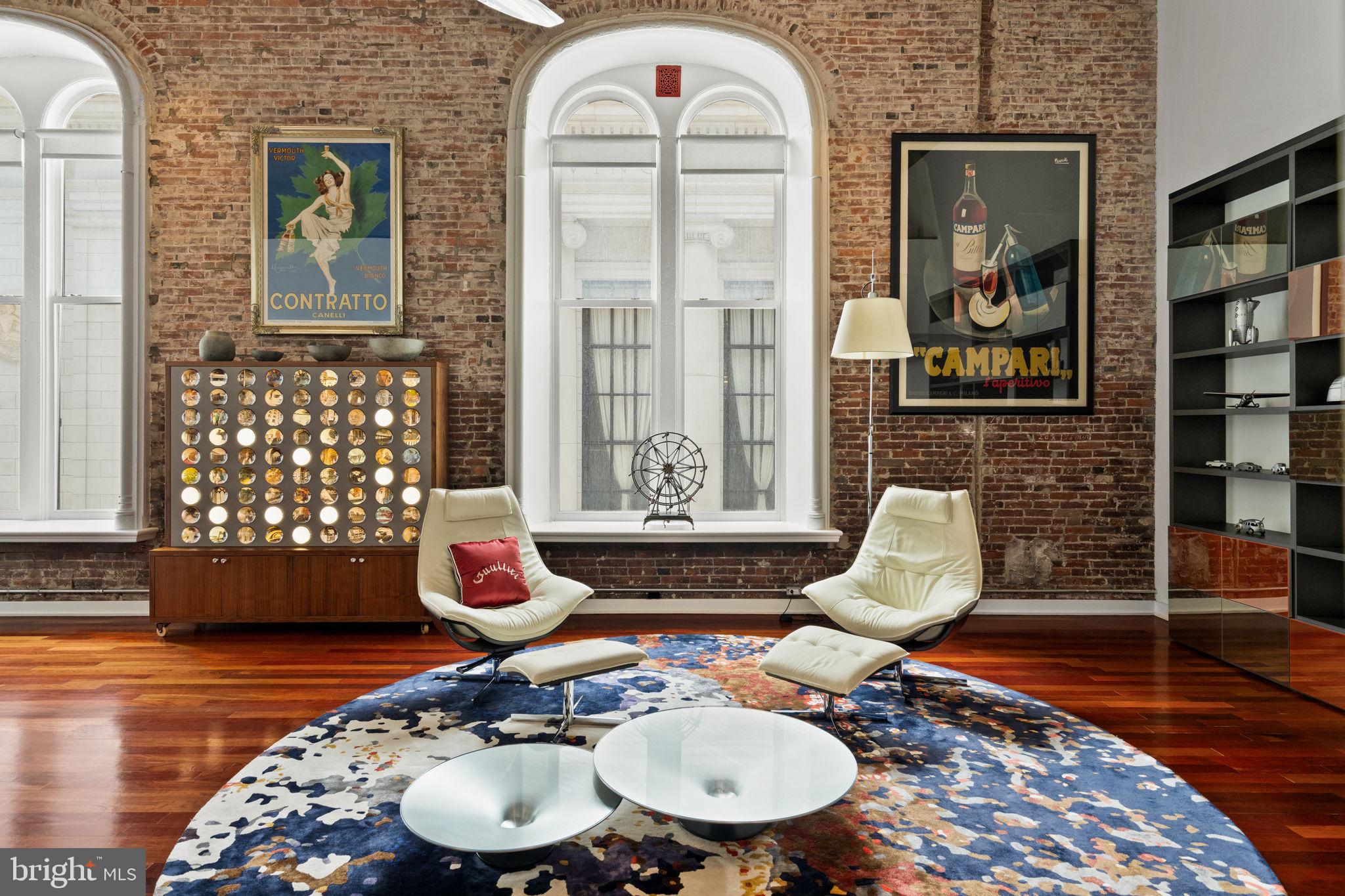 Experience refined urban living in this extraordinary combined residence at the iconic White Building, ideally located at 105 S 12th Street. Spanning approximately 3,250 square feet across Units 202/203, this one-of-a-kind home seamlessly blends historic character with sophisticated modern upgrades.

This expansive 3-bedroom, 4 full and 1 half-bath residence has been thoughtfully reimagined with both design and comfort in mind. Rich original Brazilian cherry wood floors run throughout, complemented by custom millwork and fully renovated closets crafted in matching cherry wood. Two striking spiral staircases have been transformed into architectural focal points, featuring a blend of steel and wood that echoes the home’s warm, contemporary aesthetic.

The chef’s kitchen features premium finishes, including elegant Carrara marble countertops, a Wolf induction cooktop, and a Sub-Zero refrigerator perfectly suited for both everyday living and entertaining. A custom Vicoustic wall enhances acoustics and comfort, adding a unique layer of luxury rarely found in residential spaces.

Nearly all bathrooms were fully remodeled in 2020, showcasing imported Scavolini fixtures and high-end finishes throughout. The layout has been intelligently redesigned to maximize flexibility. This includes converting the original kitchen in Unit 202 into a fully functional bedroom with its own bathroom ideal for guests or private living quarters.

Distinctive design elements abound, including cast iron and glass French doors and a stunning 5x7 picture window that floods the space with natural light, creating an inviting and open atmosphere.

This is a rare opportunity to own a meticulously curated residence in one of the city’s most sought-after boutique buildings where timeless craftsmanship meets modern luxury.

(Seller to offer a 1 year pre-paid parking credit to be used at  a local parking lot or garage of the buyers choice with an acceptable offer.  )