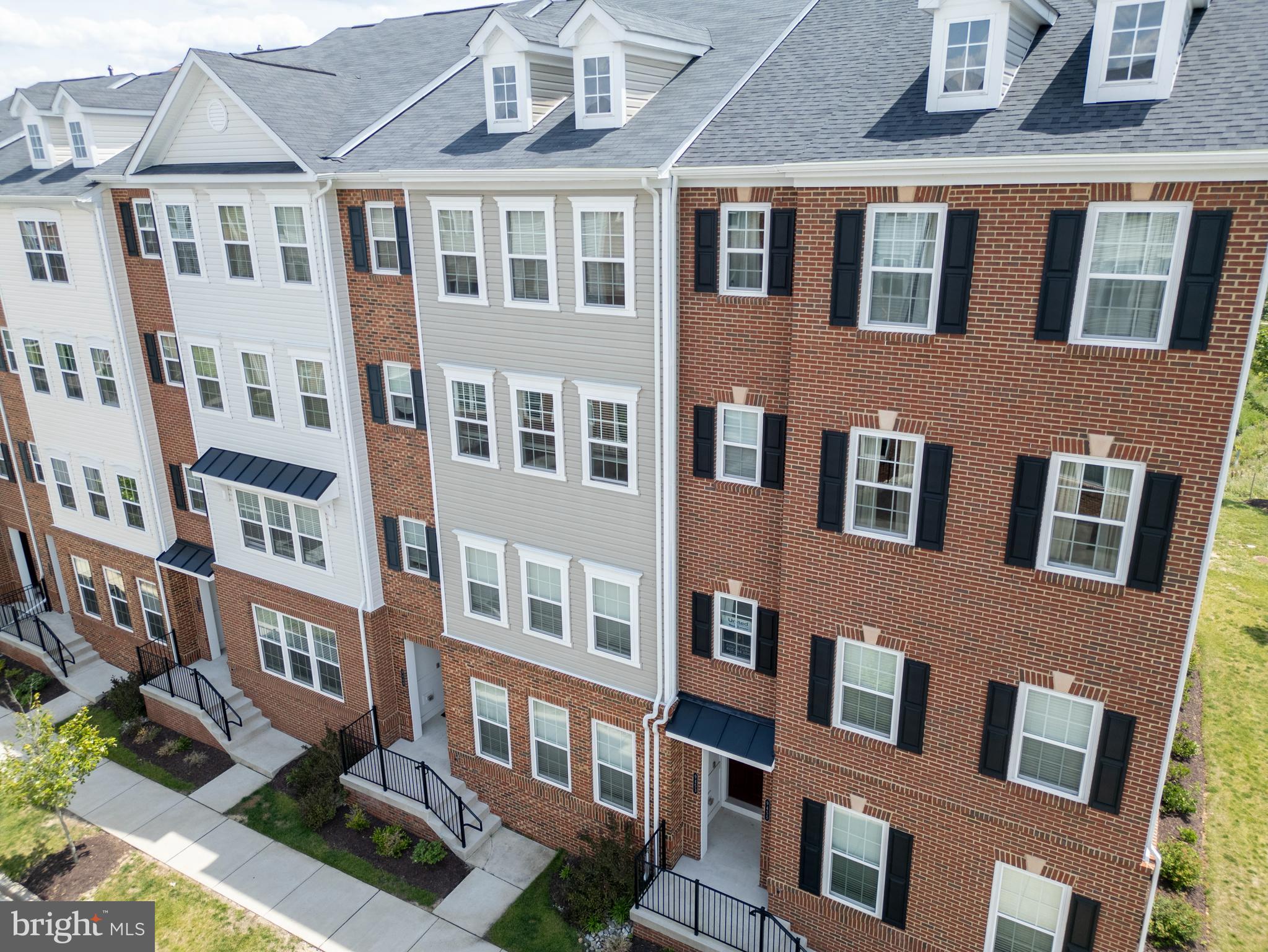 Welcome to this stunning 3-bedroom, 2.5-bath townhome in the sought-after Ballard Green community of Owings Mills. Built in 2021 and offering an impressive 2,598 sq ft of living space, this home is filled with beautiful custom upgrades and modern conveniences.  Step inside to an open-concept main level featuring hardwood floors, a spacious living room with custom built-in bookshelves, crown molding, skylights, and balcony access. The show-stopping kitchen boasts stainless steel appliances, a gas stove, granite countertops, a large island, pantry, white cabinets, and decorative backsplash—perfect for both everyday living and entertaining.  Upstairs, the primary suite offers a huge walk-in closet, upgraded shower, and custom vanities. Two additional bedrooms share a full bath with double-sink vanity and shower/tub combo. All bathrooms are finished with tile flooring, and the laundry area is conveniently located on the upper level.  Outside, enjoy a deck overlooking a serene field and landscaped grounds. The home includes a 1-car garage and concrete driveway. Community amenities include a pool, clubhouse, fitness center, trails, picnic area, and playground.  Ideally located near I-795, I-695, and Metro access, with shopping, dining, and groceries just minutes away at Mill Station Mall. Designed for entertaining, work-from-home living, and low-maintenance lifestyles, this exceptional home is move-in ready and the owner is motivated to sell—schedule your showing today and bring your best offer!