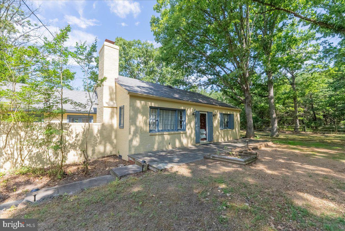BACK ON THE MARKET!!!  Exceptional 7.58+/- Acre Property in the Heart of Potomac!  Welcome to this unique property offering 7.58 acres of serene, picturesque landscape in the heart of Potomac. This charming estate includes a single-family house and a detached studio, perfect for a variety of living arrangements or rental opportunities.


This property is zoned RE2, which allows for the subdivision of the lot into three 2-acre parcels, providing incredible development potential. Located close to shopping centers and situated in a top-rated school district, this property combines the best of convenience and natural beauty. Whether you're looking to develop or simply enjoy a private retreat, the possibilities are endless.


The main house features two cozy bedrooms, providing a comfortable and intimate living space. The spacious living room is enhanced by a warm fireplace, creating a welcoming atmosphere for family gatherings or quiet evenings at home. The bright and airy sunroom offers a perfect spot for relaxation, allowing you to enjoy the beauty of the outdoors from the comfort of your home. The updated kitchen is equipped with modern amenities, making it a joy to prepare meals and entertain guests. The contemporary updated bathroom provides a luxurious touch to the home. A convenient two-car garage offers ample parking and storage space. The house is equipped with a new mini-split cooling and heating system with a three-unit zone, ensuring comfort throughout the year. Beautifully finished hardwood floors add an elegant touch to the living spaces.


The detached studio is a versatile space with large glass doors and windows that flood the interior with natural light and offer stunning views of the surrounding wildlife. The studio features an updated bathroom, a new washer-dryer combo, and a new stove, providing all the conveniences needed for a comfortable living or working environment. New carpet adds warmth and comfort, while a new mini-split cooling and heating system ensures a pleasant climate year-round.


Both the house and the studio are currently rented and generating income, making this an excellent investment opportunity. The property's mature landscaping around the house and the majestic trees throughout the area create a tranquil and private setting. Adjacent to the Serpentine Barrens Conservation Park, this property offers direct access to over 150 acres of protected parkland, perfect for nature lovers and outdoor enthusiasts.  Explore this rare opportunity before it’s too late!
