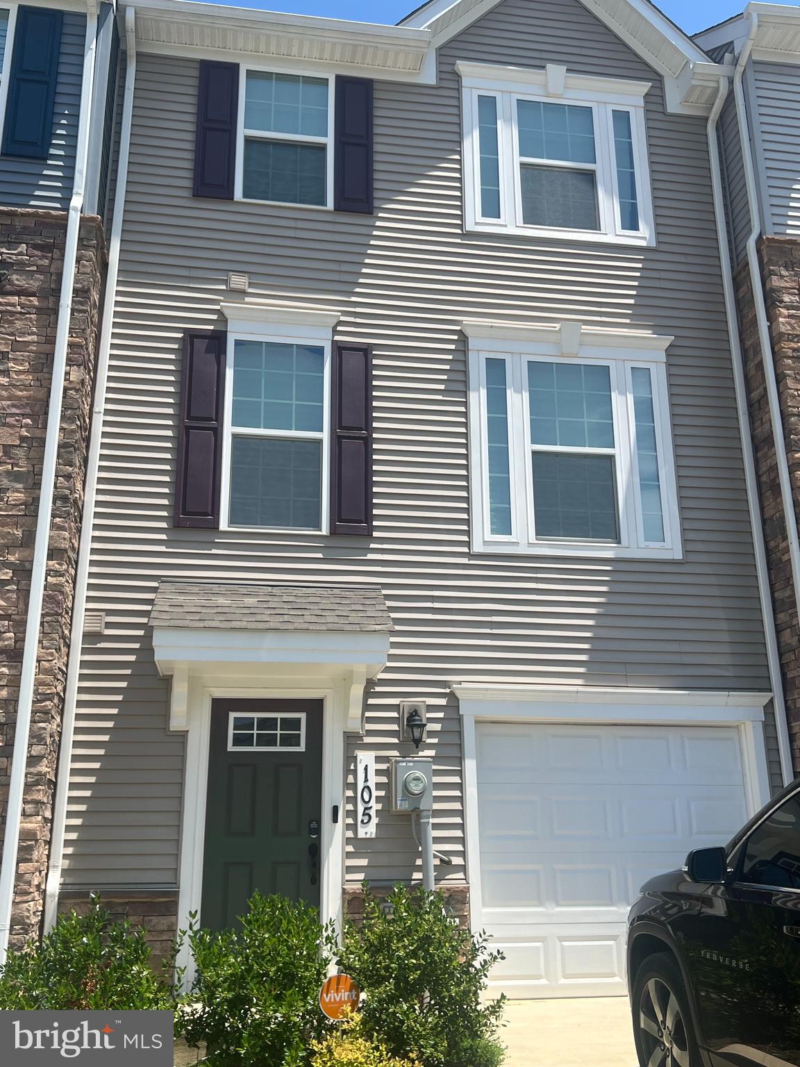 5.375% ASSUMABLE LOAN- Also Eligible for 100% financing (USDA) - Up for sale is an absolutely beautiful model with all of the bells and whistles. This gorgeous home is 4 years young and still like brand new. There is an abundance of living space with a wide open floor plan on the main level. Entertain your guests with a gourmet kitchen, oversized cabinets, and a beautiful island with seating. The main level has a half bath and opens to a nice elevated deck with privacy fencing left and right, with a nice green view. Enjoy a perimeter unit with no facing rear neighbors. The lower level features a beautiful multi-use room with a walkout door to the patio, garage access, a half bath, and a foyer. The upper level is absolutely beautiful. The primary bedroom has a tray ceiling and an ensuite bath with dual shower heads and gorgeous tile upgrades. The laundry is on the upper level for convenience. This unit is waiting to be your beautiful new home.