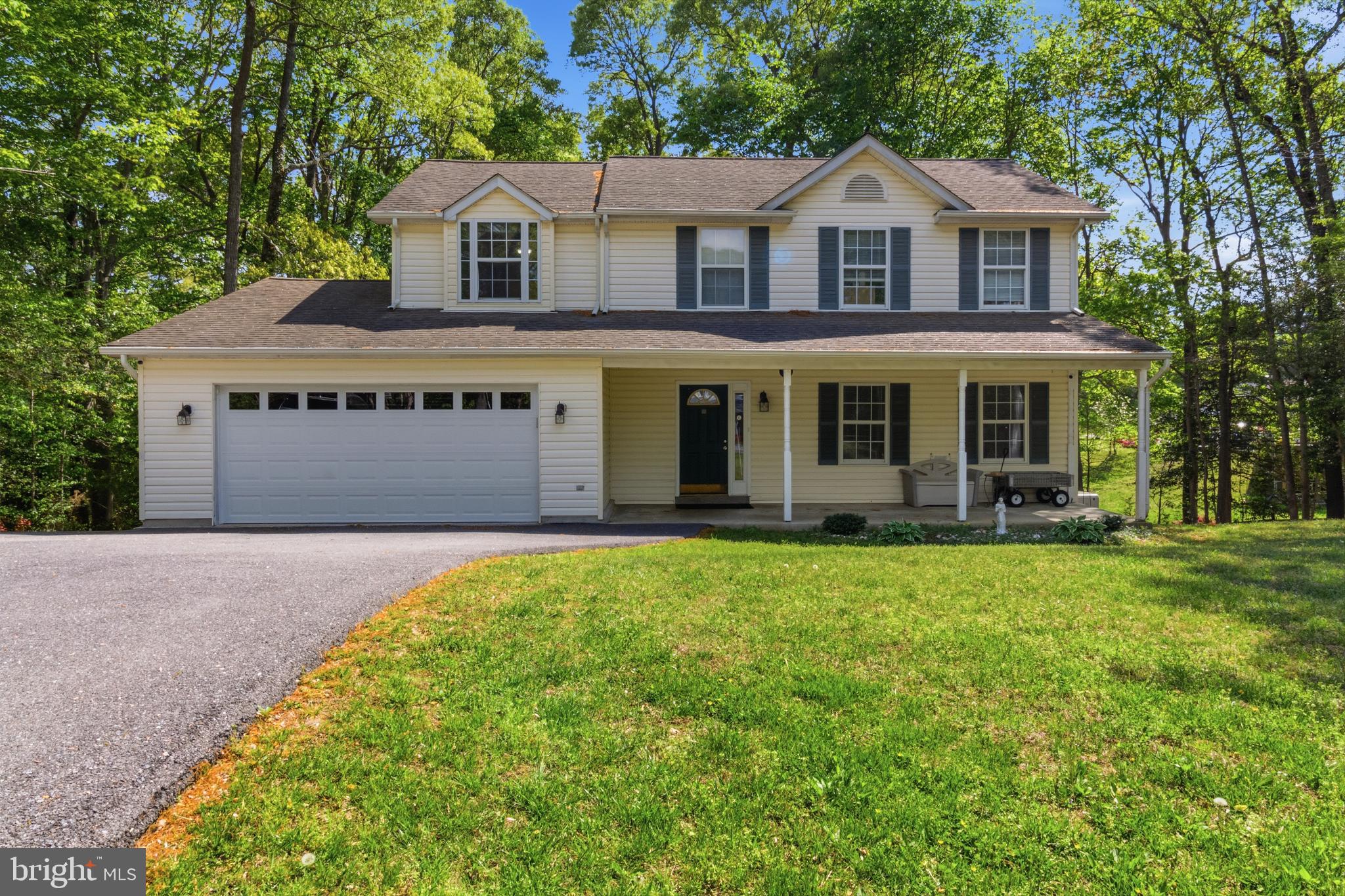 Look for our OPEN HOUSE this Saturday 12-3 PM.
This well established beachfront community with annual events for family and friends awaits you soon! Enjoy visiting this beautiful home as you pull into the expansive driveway after a hard days work! 
The new steel 2 car garage door with remote will keep you out of the weather too! Enjoy relaxing on your concrete front porch or sun-filled rear deck with stairs.
As you enter the home after a hard days work, enjoy gleaming hardwood flooring throughout the entry foyer, living, dining and family room. The expansive kitchen has a brand new range/oven as well as stainless steel appliances and generous center island for fun and gatherings to come! 
The second floor boasts 4 bedrooms with generous  room sizes. An owners suite offers a large walk-in closet and ensuite with separate corner soaking tub & shower. The three additional bedrooms enjoy large sun filled windows. 
Heading to the lower level has wonderful flex space, perfect for home gym, office, recreation room or even as separate living area with a 5th bedroom & kitchenette. A covered rear entry includes a double French door. 
The well maintained yard and exterior is perfect for fun times to come. The paved drive was expanded for recreation vehicles, boat or extra cars for family & guests. 
No formal HOA lets you enjoy the flexibility with a non-mandatory civic association  with a voluntary small annual fee. Come and enjoy the beach and all recreational fun to come.
Never worry about power outages with the Generac 24kw whole house generator supported  by two new 120 gallon propane tanks.  Four exterior mounted cameras and security system will convey.