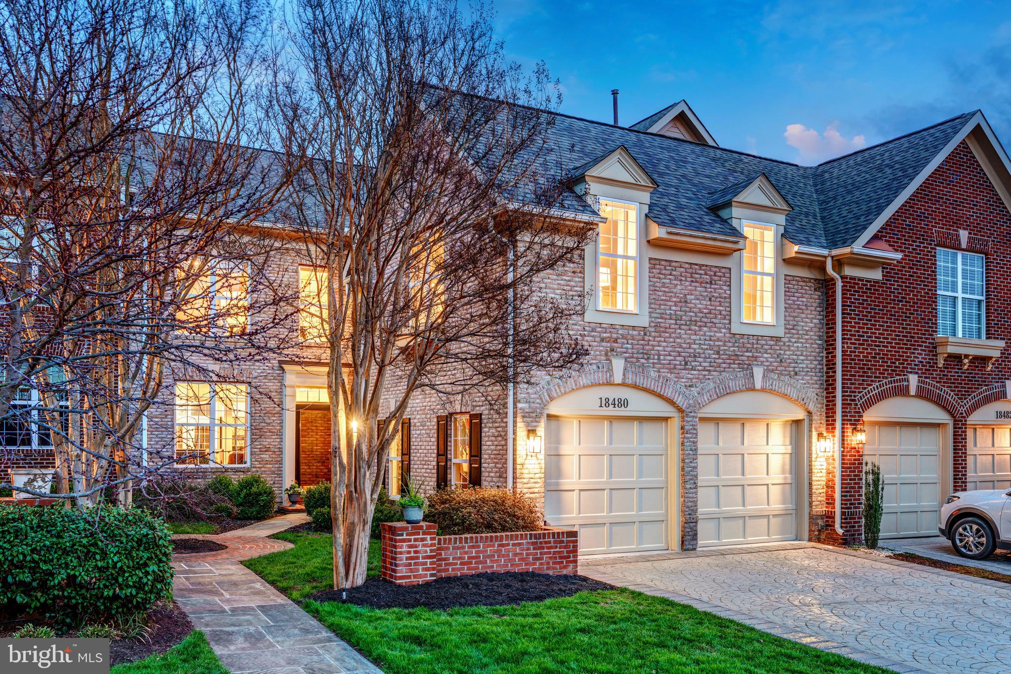 SELLERS ACCEPTED A SIGHT UNSEEN OFFER. Experience Leesburg living at its finest in this upgraded luxury townhome by Mitchell & Best, located in the prestigious River Creek gated community along the Potomac. Featuring an open floor plan with high ceilings, designer finishes, and multiple decks overlooking private outdoor spaces, this residence provides an ideal setting for both entertaining and everyday comfort. Arriving home, manicured landscaping and a charming stone and brick path lead to your formal entry and two-car garage. Inside, the main level unfolds into a bright, open-concept layout featuring high ceilings and abundant natural light. Formal living and dining areas showcase elegant crown and chair rail moldings. The family room flows into the gourmet kitchen, which features a marble island, contemporary lighting, abundant all-white cabinetry, stainless steel appliances, and a bonus pantry. Enjoy casual meals in the bay window breakfast nook or move directly onto your covered deck for outdoor dining. Upstairs, your primary suite awaits with airy tray ceilings and a generous sitting area that opens onto a private balcony. Two walk-in closets lead to a spa-inspired bath with an oversized frameless shower and white Shaker double vanities. Two additional bedrooms are located on this level, one impressively sized with cathedral ceilings, as well as an updated full bath with subway tile and the laundry room with stacked LG front-loaders conveniently nearby. The lower level expands your living space further with another large gathering area that opens onto the shaded paver patio and fully fenced backyard. A versatile fourth bedroom on this level can easily serve as an office or guest suite, and an unfinished storage room has a wet bar, sink, and full refrigerator, with additional potential to customize. Enjoy peace of mind with recent upgrades including a new roof (2022), HVAC system (2022), hot water heater (2023), and carpeting (2022), plus new LVP floors in the lower bedroom (2023). The River Creek community offers exceptional amenities: over 600 acres of dedicated open space, seven miles of private trails for walking or biking, picnic areas, Potomac River access with canoe/kayak storage facilities, championship golf course designed by Ault Clark, tennis courts, basketball courts, swimming pools, plus a clubhouse featuring dining options and fitness center. Situated approximately 25 miles from Washington D.C., you're minutes from downtown Leesburg's vibrant restaurants and shops, major commuter routes, Ashburn Metro Station, Dulles Airport, wineries, breweries, farm markets, Wegmans, Whole Foods, One Loudoun Town Center, Leesburg Corner Premium Outlets, Village at Leesburg, and Leesburg Plaza shopping centers. Here is your opportunity to own a beautifully renovated townhome in one of the area’s most sought-after neighborhoods. Welcome home!