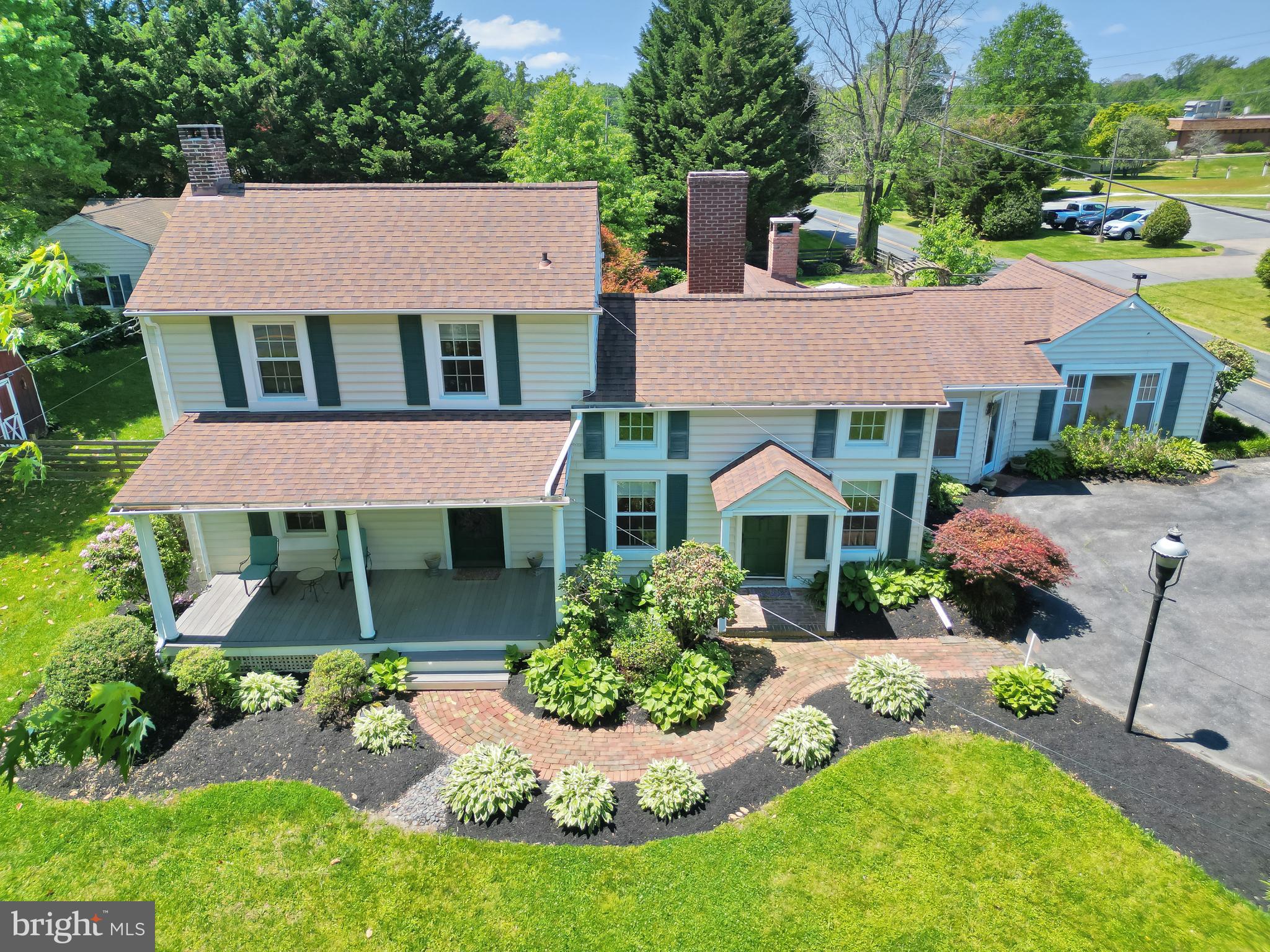 BACK ON THE MARKET DUE TO BUYER FINANCING. EXCELLENT OPPORTUNITY FOR A BUYERS WHO'S READY TO GO!  If Authenticity, Historic Charm and a Beautifully Unique, Forever Home are what you're seeking, your search is over!  Where Historic Elegance Meets Modern Luxury! This One-of-a-Kind Home in Fallston checks off all the boxes! Step into timeless charm & contemporary comfort w/this extraordinary 2,500 sq. ft. circa 1850s historic home, fully remodeled to perfection. Nestled on a .62-acre landscaped lot w/ Private gardens & view of the Quaker Meeting House, this 4 BR, 3 & 1/2 BA residence is The Belle of Harford County. Here you'll find sun-filled rooms & a flowing, open floor plan, perfect for entertaining guest, a "work from home" dream environment, or just enjoying a staycation at home in your own private retreat.  Just imagine the gourmet meals you will create in this updated Top Chef's Dream-Come-True kitchen w/stunning white quartz countertops, a custom coffee bar, & GE Profile stainless steel appliances designed for entertaining & everyday luxury. Tucked out of the way but perfectly convenient is the first-flr laundry w/high-efficiency LG W&D adding convenience & style. The spacious main-level primary suite features elegant new built-ins & serene garden views, blending indoor & outdoor living. The newly updated en-suite Bath offers a large double shower, double vanity, & custom quartz built-ins reminiscent of a spa-like retreat you’ll never want to leave. On the other side of this amazing home, in its own private wing, you'll find a second en-suite bedroom which provides flexibility for guests or multigenerational living, while the 3rd & 4th BRs located upstairs are generously sized & suitable for office, creative crafting, workout-spa or whatever your heart desires! These two bedrooms share the 3rd full bathroom.  A huge Bonus feature is the modern detached studio/office/recreation room w/vaulted ceilings & extensive storage, secluded behind the house backing to trees.  You'll love this space for how well it adapts to being the perfect location for remote work, hobbies, entertaining, the possibilities are endless! The built-in desks can stay as well as the pellet stove to cozy up to on chilly days and nights! You'll love spending time walking the grounds of this home w/its impressive, extensive, professional landscaping that goes on and on.  Timeless classics like, hydrangea, peonies & more grace this magnificent property's front, back & side yards, a reflection of the years of meticulous love & care given to the wellbeing of this home. The backyard patio features a gas powered firepit, & private deck & garden area off of the primary bedroom. There is extensive storage w/two spacious storage sheds-one 10' x 20', the other 10' x 14'—ideal for tools, gardening supplies, or recreational gear. The fully fenced backyard offers both privacy & a welcoming place in a park-like setting to relax or gather. Tomatoes and herbs are already planted for you. The unfinished basement is ready for your workshop, gym, or studio, & the home is equipped with warm, energy-efficient oil heat via forced air vents in winter & CAC via heat pump in summer, ensuring year-round comfort. Lovingly maintained by one family for 40 years, this home is a rare blend of historic soul and contemporary style-ready for YOU to begin its next chapter. As an additional benefit, the Gunpowder State Park is less than a mile away w/tons of trails for hiking, biking & fun swimming holes in Little Gunpowder falls.  Finally, You can volunteer to host the Reunion, The Big Game, Movie Night, Crab Feast, Garden Party or Holiday Festivities!!! Your home will be the place to be! Off the beaten path yet Close to everything you need! APG, Hospitals, Schools, Parks & Rec, Libraries, Restaurants, Marinas & major arteries of travel!  Don’t miss this unique opportunity to own a beautifully reimagined piece of Fallston’s history. Welcome home to 716 Old Fallston Rd. "NO HOA"!