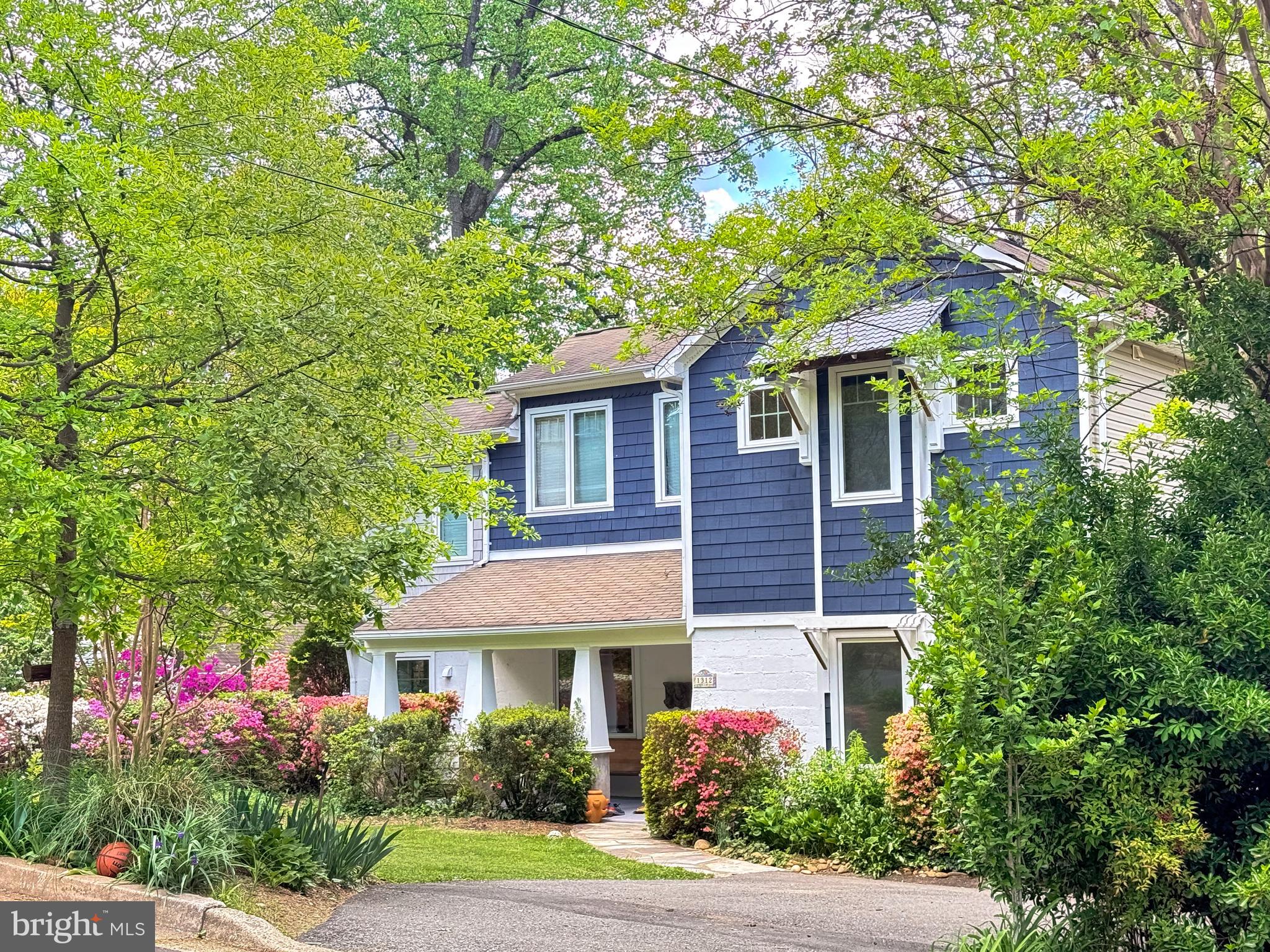 Tucked within one of Falls Church City’s most sought-after, tree-lined neighborhoods, this exceptional 6-bedroom, 5-bath single-family home offers the rare combination of modern convenience, timeless character, and an unbeatable location close to everything the Little City has to offer. Thoughtfully expanded and updated, the home blends warmth, charm, and functionality across three finished levels.
Step inside to find oak hardwood floors spanning the main and upper levels, neutral paint throughout, built-in bookcases, and architectural details that give the home distinctive character. The main level is designed for comfortable living and effortless entertaining, with a screened porch overlooking the private rear yard and mature landscaping beyond. Two main-level bedrooms share a full bath, offering flexibility for guests, main-level living, or multi-generational needs.
The recently remodeled kitchen is both stylish and functional, featuring quartz waterfall countertops, white cabinetry w/ brass hardware, stainless steel appliances, including a Wolf range and hood, pot filler, oversized farmhouse porcelain apron-front sink, commercial-style pull-down brass faucet, and a dedicated coffee station designed for everyday enjoyment. An office or playroom just off the kitchen provides the perfect work or recreation space while being thoughtfully positioned for privacy and separation from the main gathering areas.
Upstairs, the spacious primary suite boasts ceilings just under 10 feet, a sitting area, dual closets, and a well-proportioned bathroom with water closet. Two additional generously sized secondary bedrooms are connected by a dedicated lounge ideal for study, play or relaxation. Each secondary bedroom also enjoys its own bath.
The lower level offers outstanding versatility, with interior access as well as a dedicated rear entrance through a convenient mudroom with abundant storage for backpacks, sports equipment, strollers, or Costco hauls. This level lives like a true apartment and is ideal for an au pair suite, in-law suite, home office, or rental opportunity. It may also function as a simple extension of the already ample living space above, perhaps as a recreation or media retreat.
Outside, the expansive lot provides abundant play space, mature landscaping, and room to explore future expansion possibilities, including an ADU (Accessory Dwelling Unit) or an attached or detached two-car garage.
An exceptional chance to own a character-filled, move-in ready home with space, flexibility, and modern updates in one of Northern Virginia’s most beloved communities. Ideally located with easy access to Downtown Falls Church City’s shops and restaurants, Founders Row, Cherry Hill Park, the W&OD Trail, the new flagship Whole Foods, West Broad Street (Route 7), I-66, and both East Falls Church and West Falls Church Metro stations. Enjoy Falls Church City Public Schools and quick commutes to Tysons, McLean, Arlington, and Washington, DC.  *Photos marked with an asterisk have been virtually staged to add or remove furnishings.