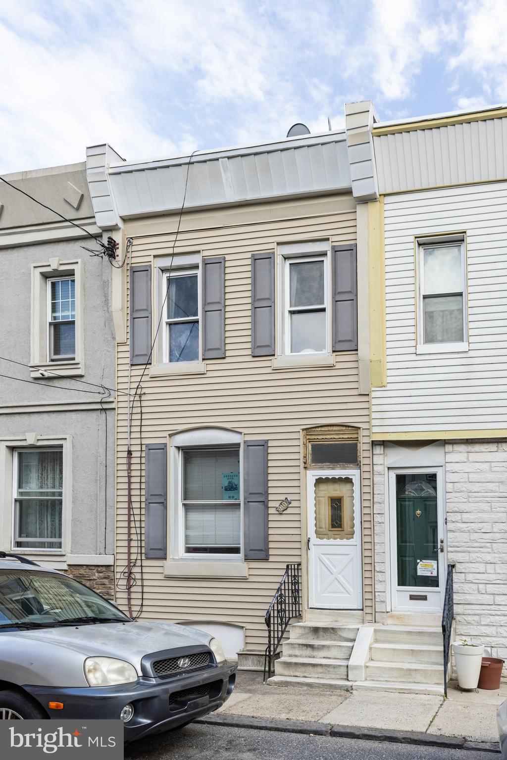 Located on a quiet, established block in Port Richmond, 3107 Miller Street is a traditional two-story brick row home with plenty of potential for a modern update. The house features high ceilings and beautiful original hardwood floors throughout, offering a great starting point for someone with a discerning eye. The layout includes a spacious living area, a vintage kitchen, two bedrooms, and a compact bathroom. Additional features include a nice-sized backyard for outdoor space and a full, unfinished basement suitable for extra storage and laundry. This property is being sold in "as-is" condition. Property is currently being lease until 11/30/26. This is a solid opportunity for an investor or a buyer who wants to truly make this home their own in this popular neighborhood.