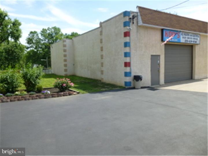 Immaculate, move-in-ready commercial garage/shop property with excellent visibility and high traffic exposure at the Bensalem/Philadelphia border. Renovated office space is township approved and handicap accessible. Features include ceramic tile bathroom with shower, commercial-grade garage door opener, exhaust fan, updated HVAC, 50-gallon water heater, washer/dryer hookup, and secure loft storage.

Entire building has been fully rewired with two 200-amp panels and is fully insulated with stucco exterior and rubber roof. Professionally paved and landscaped. Lot size 82x200 with room to expand. Clear Phase I & Phase II environmental studies completed. Seller financing available.

Property lines do not match fence lines. Property extends beyond the fenced area to the large tree. The parcel beyond the tree is a separate lot and is not included in the sale