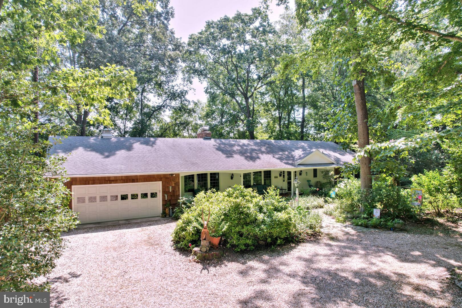 Beautiful waterfront home with dock on the Nanticoke River.  You'll be impressed with this immaculate 4-Bedroom, 3-Bath ranch with apx. 2,800 sq. ft. of living space.  Relax and enjoy nature and river views from multiple areas both inside and outside of this spectacular home.  The updated kitchen and baths are just two of the key features sure to please every homeowner.  Two primary bedrooms with ensuite baths offer flexibility and convenience.  In addition to an attached double garage, you'll also find a detached double garage with overhead finished space suitable for a "mancave" or extra storage.  There's even a built-in EV charger for the economy minded!  A nature lover's paradise . . . you just can't imagine the wide variety of trees, shrubs, and plants that are featured on the private 1.76-acre wooded lot.  The care it has received over the years is evident throughout this extraordinary property.  A septic certification has already been obtained.  You'll have to see for yourself all it has to offer!