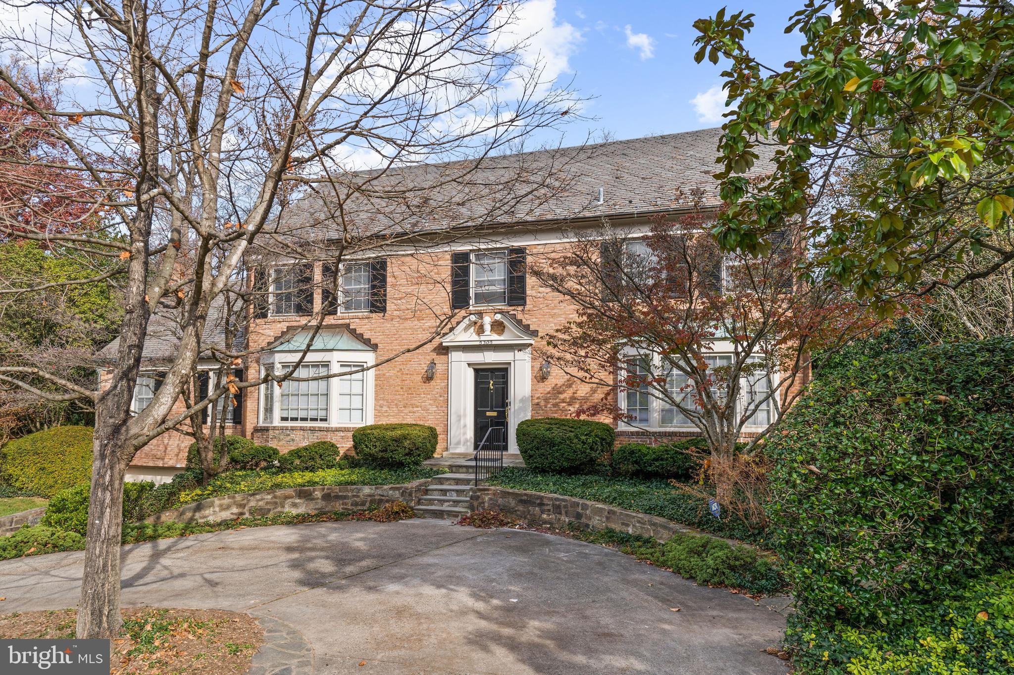 Classically elegant and immaculately maintained brick Colonial on a cul-de-sac street in the highly-coveted Sumner Park area of Westmoreland Hills. Masterfully-landscaped property with mature gardens, winter-blooming jasmine, tea roses, English boxwood, and magnificent Magnolia Grandiflora trees lining an attractive double-height fence, creating the utmost privacy. Filled with natural light, this distinguished 6,100 square-foot (estimated) home offers six bedrooms, four full and two half bathrooms, four fireplaces, and an elevator across three levels of living. The main level impresses with a spectacular floor plan boasting multiple glass doors to rear patios overlooking the verdant backyard, which creates a wonderful flow for entertaining.  Featuring a formal entry foyer with an elegant staircase; a gracious living room with a Bay window, French doors to the garden, and a beautifully-detailed fireplace; a grand dining room with a fireplace and custom shutters on the long windows facing the garden on two sides; a sun-drenched kitchen and breakfast room with skylight; a generously-sized family room with built-ins, a third fireplace, and a wall of windows with French doors opening onto the garden; a bright, cheerful study with built-ins on three walls and a bay window; and a powder room.  The second level enjoys four bedrooms and three full bathrooms, including the primary suite with mature tree-top views, abundant closet space, a dressing room, and an en suite full bathroom. There is excellent storage with a sizable hall linen closet.  Two additional bedrooms and one full bathroom, all overlooking the beautiful rear yard, are located on the third floor of the home. The lower level includes a large, finished recreation room with a fourth fireplace, a bonus room that could be used for guests, a half-bathroom, a finished laundry room, and excellent storage. Rarely available two-car garage with an expansive circular driveway provides ample parking. A whole-house generator and the elevator serving three levels gives owners peace-of-mind.  With neighborhood parks and trails nearby, this spectacular residence offers tranquil living while being in close proximity to both Spring Valley and Westbard Square shopping districts, Metro, downtown DC and Bethesda. Steps to Capital Crescent Trail, Little Falls Park, and Westmoreland Park.  Westbrook, Westland, B-CC schools serve the neighborhood.   Welcome home.  ((Square footage is estimate provided by a third-party vendor.))

HOME FEATURES: 
Masterfully-landscaped grounds with mature gardens
Winter-blooming jasmine, tea roses, English boxwood, and magnificent Magnolia Grandiflora trees lining an attractive double-height fence
Formal entry foyer with elegant staircase
Gracious living room with Bay window and French doors to garden
Four fireplaces throughout the home
Elevator access to three floors
Spectacular floor plan with multiple glass doors to rear patios
Grand dining room with fireplace and custom shutters
Sun-drenched kitchen and breakfast room with skylight
Generously-sized family room with built-ins and fireplace
Bright and cheerful study with built-ins and bay window
Powder room on main level
Primary suite with mature tree-top views, abundant closet space, dressing room, and en suite bathroom
Two-car garage with expansive circular driveway
Whole-house generator for peace-of-mind
Lower level includes large finished recreation room with fireplace
Finished laundry room