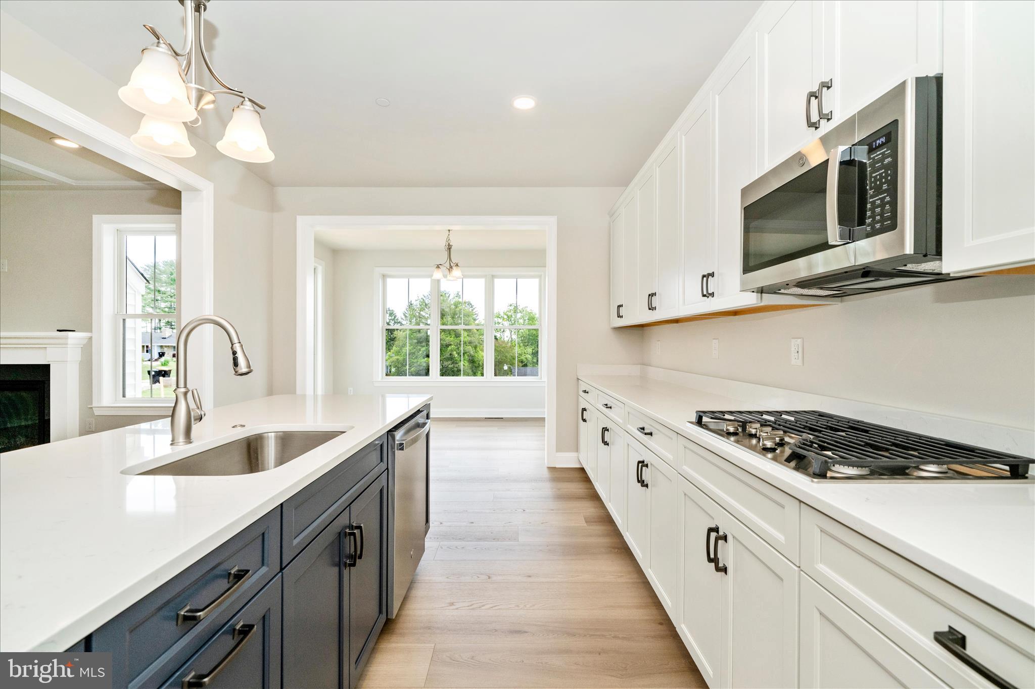 New construction. Walkable lifestyle. Luxury finishes. This is Sykesville living at its finest!! 

Welcome to Sykesville's most exciting NEW addresses- MOVE IN READY — a stunning NEW CONSTRUCTION modern farmhouse where timeless character meets luxury craftsmanship, all just a short stroll from the charm of historic downtown. Walk to award-winning restaurants, quaint boutiques, and beloved community festivals from your own front door.

Spanning nearly 4,000 square feet on a flat, open homesite, this thoughtfully designed 6-bedroom, 5-full-bath residence offers the space and flexibility today's buyers crave. The main level features a dedicated bedroom and full bath — ideal for guests or multigenerational living — alongside an open-concept layout bathed in natural light. The chef's kitchen is a true showpiece, appointed with quartz countertops, a professional gas range, and a double oven built for entertaining at every scale.

Upstairs, four generously sized bedrooms and three full baths provide the comfort and privacy every member of the household deserves. The finished lower level adds incredible versatility — a sixth bedroom, full bath, and expansive living space perfect for a home theater, gym, or recreation room.

Outside, the flat and open homesite offers a rare blank canvas to create your dream outdoor retreat. Brand new construction means modern energy efficiency, the latest building standards, and the peace of mind that comes with everything being yours from day one.