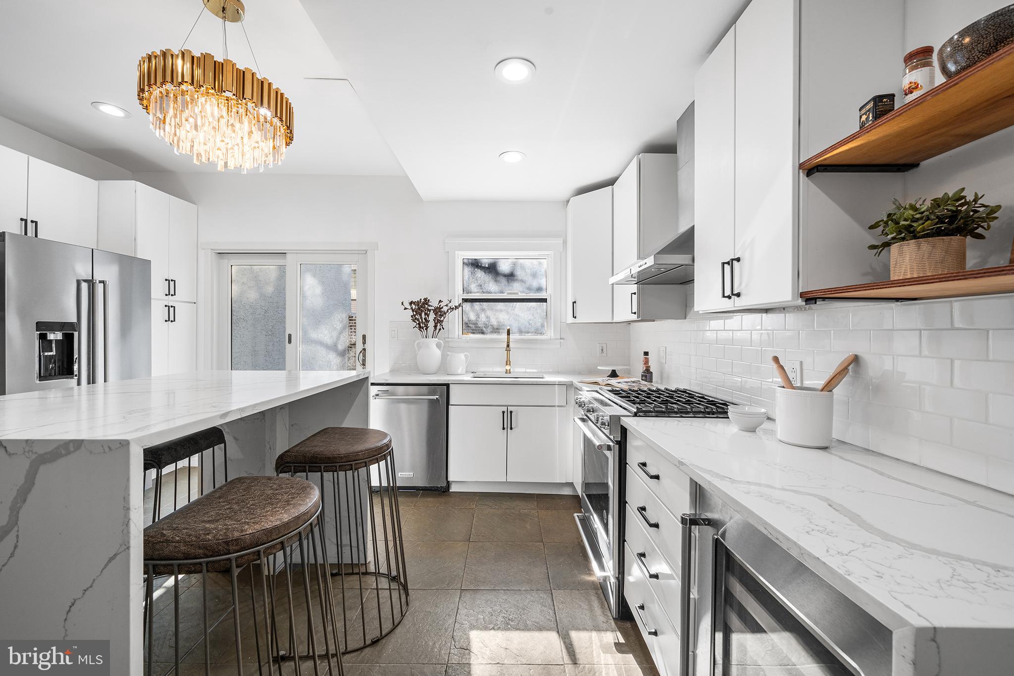 Live in a walker's Paradise, just steps from Rittenhouse Square Park, surrounded by many of the city's best restaurants, shopping, and conveniences, 1932 Pine St. is the ideal address for those wanting to be within arm's reach of all that the city offers!

Enter from the beautiful tree-lined Pine Street into the huge living space, with high ceilings, that's made for entertaining and comfort. A fully-renovated, modern kitchen connects the living space to a stone patio on the rear of the property, complimented by gorgeous foliage in a natural and private setting. 

Original wood floors pair character with the endless updates and modernization brought about by a recent renovation throughout. On the second floor, a primary suite is complete with ensuite bathroom and second floor sundeck. Down the hall, find another spa-like bathroom with rainfall shower, dual vanities, and great natural light. The third floor is home to two additional bedrooms, each spacious and bright. The lower level, accessed from the kitchen, has great storage space, as well as laundry and a powder room. NEW third floor ROOF being installed May 2026.

Rittenhouse Square is the premier Center City neighborhood and it is loaded with some of the best restaurants, cafes, and shopping that the city has to offer. There are several monthly parking options within the surrounding blocks and ample options for public transportation as well. Fitness and wellness options are nearly unlimited in the neighborhood, as are dining options. The walk score for this property is 98, and it also ranks at the highest levels for public transportation (100) and biking (98).