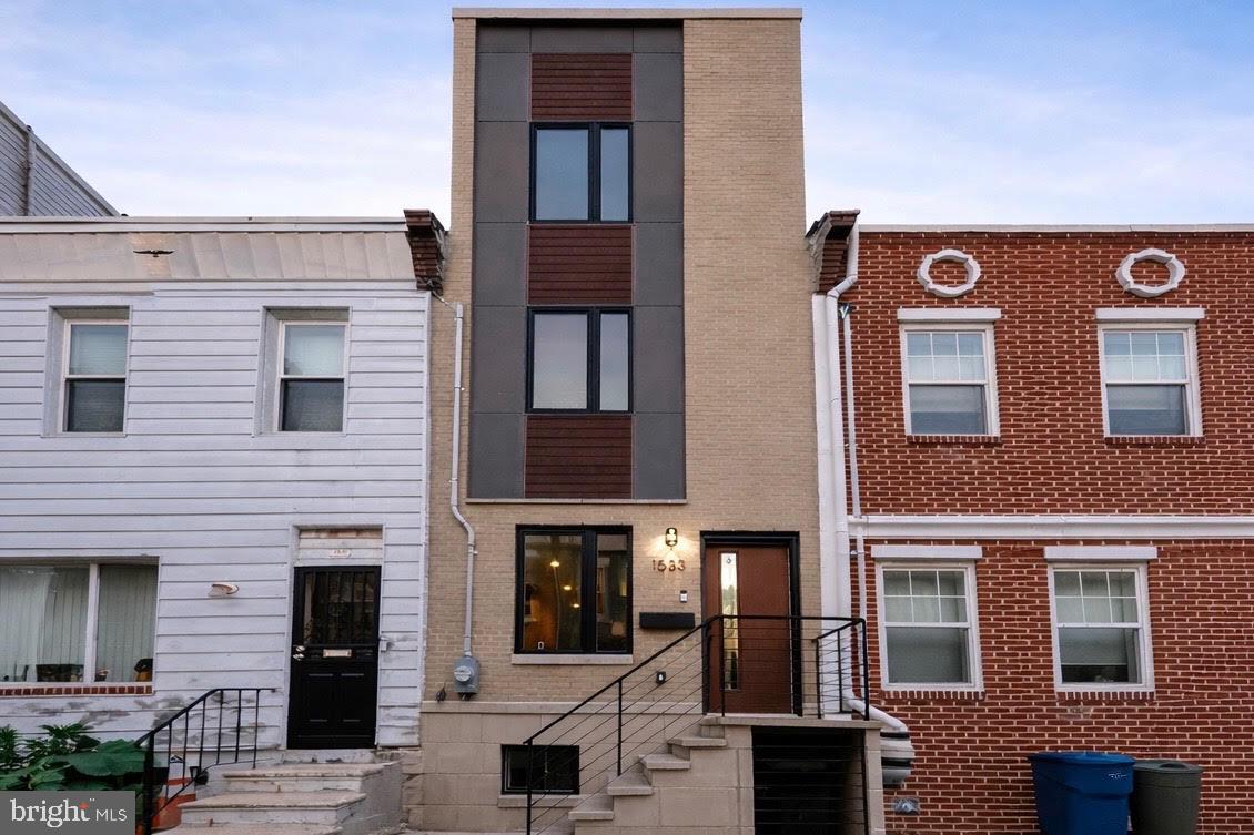 Contemporary 3-Bedroom Home with Rooftop Views in Point Breeze | Assumable FHA Loan at 2.375%
Stylish and spacious, this 3-bedroom, 2.5-bath home in vibrant Point Breeze offers contemporary design and quality craftsmanship throughout. The open floor plan features high ceilings, recessed lighting, and sleek hardwood floors, creating a bright and inviting living space.
The chef’s kitchen includes white quartz countertops, a subway tile backsplash, stainless steel appliances, and high-end cabinetry, and opens to a private gated backyard — perfect for entertaining or relaxing outdoors.
The second floor offers two bright bedrooms, a full bathroom, and a conveniently located laundry room. The third-floor primary suite features a luxurious spa-style bathroom with double vanity and glass-enclosed shower, a walk-in closet, and access to a private rooftop terrace with stunning city views.
The finished basement provides versatile space ideal for a family room, home office, or gym and includes a half bathroom.
This property can be purchased with an assumable FHA loan at 2.375%, offering a rare financing opportunity for qualified buyers. The home also benefits from 6 years remaining on the 10-year tax abatement, providing continued property tax savings.
Enjoy the best of city living — just minutes from Rittenhouse Square, neighborhood restaurants, breweries, parks, and public transit.