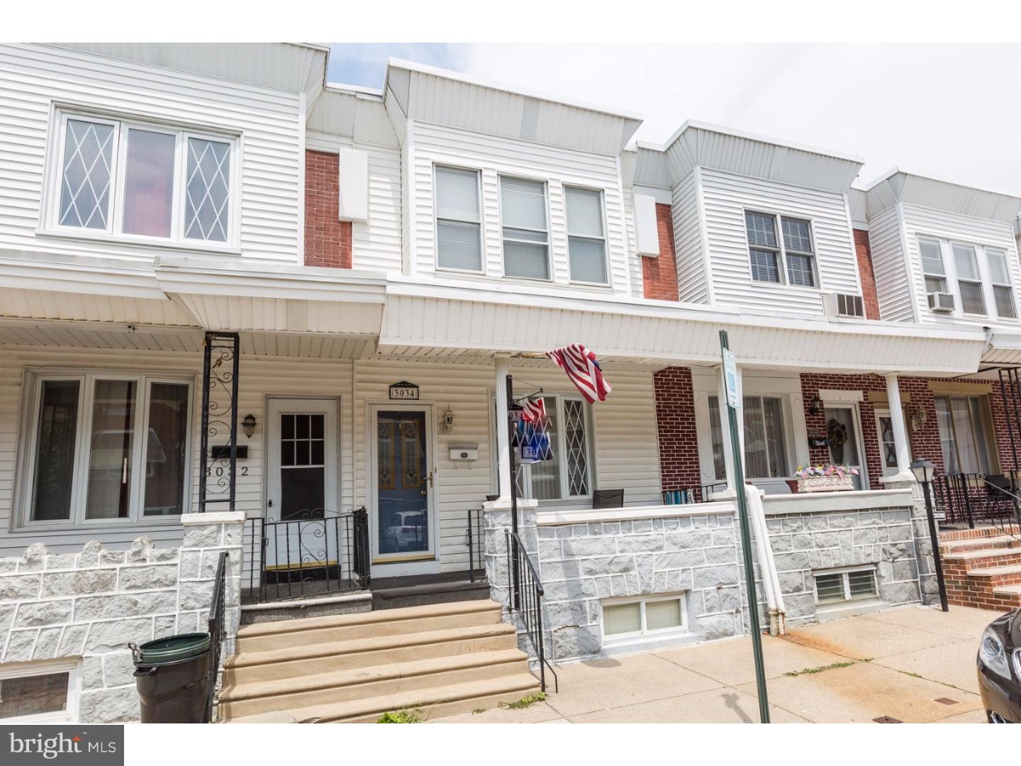We have an absolutely charming 3 bedroom porch front home with deck and finished basement located in the highly desired Port Richmond neighborhood. One of this home's most outstanding features is it's abundant windows and ample living space. Enter in from the covered porch through a full glass storm door. The living room is the size of most living room and dining rooms together but this home even has a formal dining space. There is a really beautiful custom light house window in the living room and in the Dining room there is fun glass slider doors leading to the rear deck area. The kitchen has a breakfast bar, double wide pantry, refrigerator, microwave and gas range. The living room stair rails are made of decorative contemporary wrought iron leading to the full finished basement. This room is beautiful and can serve your every need as a media room, man cave, spare 4th bedroom , etc. There is a custom built in bar are and laundry room. The 2nd floor has 3 spacious bedrooms. The master includes a double wide his and hers closet, and 3 huge windows. The full bath is completely tiled with a storage vanity and bath/shower combo. All of the doors are natural stained wood, radiator heat and central air, and multiple ceiling fans. We think you will adore this home!