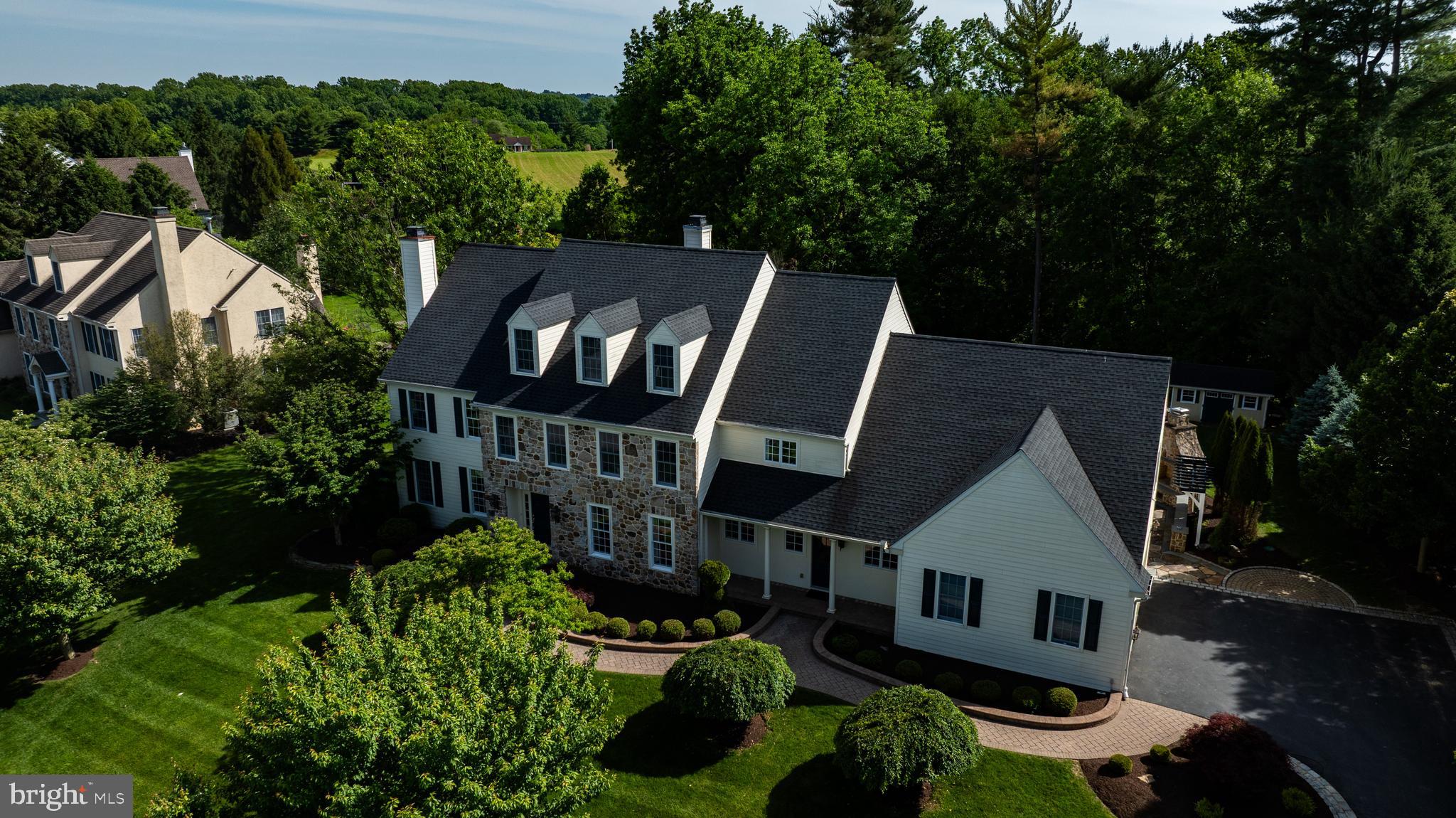 Nestled at the end of a quiet cul-de-sac in beautiful Pocopson Township, this exceptional 6-bedroom, 5 full and 2 half bath home offers the perfect combination of luxury, comfort, and convenience within the award-winning Unionville-Chadds Ford School District. Situated on a picturesque 1-acre lot, this impressive residence features a grand two-story foyer, site-finished hardwood floors, a formal living room with a gas fireplace, and a spacious family room with a cozy wood-burning fireplace. The gourmet kitchen is truly the heart of the home, offering generous workspace, abundant storage, and an ideal layout for everyday living and entertaining. The luxurious primary suite provides a private retreat with spacious walk-in closets and a spa-inspired bath, while the additional bedrooms and baths offer exceptional flexibility for family and guests. A finished lower level includes space for a home gym, recreation area, playroom, and extensive storage. Outdoor living is equally impressive, featuring a newly added natural stone fireplace, fire pit, custom walkway, and beautifully landscaped grounds designed for relaxation and entertaining. An oversized 3-car garage and abundant storage throughout the home add to its practicality. Enjoy the charm of Pocopson Township with nearby apple orchards, local mushroom farms, scenic countryside, and the beloved Northbrook Market, where residents gather for freshly prepared foods, homemade donuts, local honey, ice cream, fresh milk, and casual family dining. Offering low West Chester taxes, breathtaking surroundings, and one of the region’s most sought-after school districts, this remarkable property is more than a home; it’s a lifestyle.