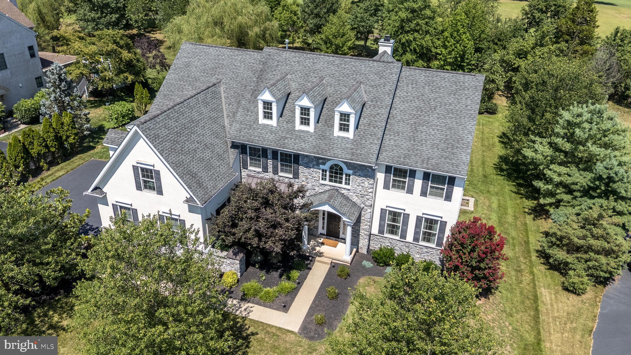 Discover luxurious living in this beautifully updated Guidi-built, 4-bedroom, 4.5-bath custom colonial w/over 4600 sq ft on a non-thru street, featuring soaring 9-foot ceilings, a show-stopping, newly finished Lower Level w/an additional 1450 sq ft, and a possible 1st floor in-law suite, perfectly positioned with panoramic views of Mainland Golf Course and directly facing community open space. Located in the sought-after community of “ The Preserve at Skippack Creek” w/amenities such as walking trails, nearby parks, & proximity to top-rated schools, shops, and less than 2 miles to the PA turnpike entrance, this property delivers convenience and lifestyle in equal measure. The 1st floor features oak hardwood floors, beginning with a welcoming foyer that leads to spacious, light-filled living areas. The stunning Gourmet Kitchen features granite counters, 42” cabinets, travertine tiled backsplash, stainless steel appliances including double wall ovens, new dishwasher (2025), new refrigerator (2024), & a large island. The Breakfast Area offers a vaulted ceiling & is open to the spacious, sun-filled 2-story Family Room w/wood-burning fireplace & custom millwork. Double French doors from the Breakfast Room also open to the exciting, Screened Porch, added in 2016, w/vaulted ceiling & high-end ceiling heaters, & providing a perfect space for entertaining or relaxing while enjoying the tranquil golf course views. The 1st Floor Office can easily serve as 1st floor Guest or In-Law Suite with its connection to the newly renovated Full Bath (2024) w/Kohler vanity w/marble counter & stall shower w/frameless glass door. The door between the Office & Bathroom is wide enough to accommodate a wheelchair. A Mud Room with utility sink also leads to a side-entrance & 3-Car Garage with included 2nd refrigerator.  Two sets of stairs converge as they lead to the 2nd floor which continues to impress w/generously sized bedrooms, including a luxurious Primary Suite offering a Bedroom with oak hardwood floor, tray ceiling & 1st professionally organized walk-in closet, Dressing/Sitting Room w/2 additional professionally organized walk-in closets, & a spacious Full Bath with 2 separate vanities, whirlpool tub & stall shower w/frameless glass door. The 2nd Bedroom is also a generous Suite w/walk-in closet, versatile connecting Sitting Room/Office/Nursery & en-suite Full Bath. Bedrooms 3 & 4 share a Jack and Jill Bath w/soaking tub & shower. The convenient 2nd Floor Laundry Room includes the washer dryer & 2nd utility sink. A full set of stairs provides access to the unfinished 3rd Floor Attic that offers an incredible opportunity for more living space or is perfect for additional storage. Prepare to be amazed by the exceptionally designed, newly transformed (2024) Lower Level with 9’ ceilings, designed with both entertainment & lifestyle in mind.  Double French doors open to the spa-worthy Gym w/gym flooring & TV included. The gorgeous Lower-Level Family Room features a 2nd fireplace (propane gas) w/heat-resistant shiplap above, built-in bench seating w/storage and a wet bar with quartz counter and included wine fridge. Another room is currently being used for a Golf Simulator but would also be a perfect Media/Theater Room. No entertainment area would be complete without the Wine Room with glass door and included shelving. Multiple utility rooms provide ample storage. The beautiful, professionally landscaped yard is designed for endless enjoyment of the surrounding scenery. Relax on the paver patio with built-in Barbecue and Firepit while watching the sunset over the golf course. Other special features include a security system, 2 zones of HVAC, Anderson windows, new hot water heater (2023) and an irrigation system. The community is in close proximity to several parks and minutes to major routes plus close to the quaint town of Skippack.  If you’re looking for a rare combination of luxury, location, and layout, this is the one!
