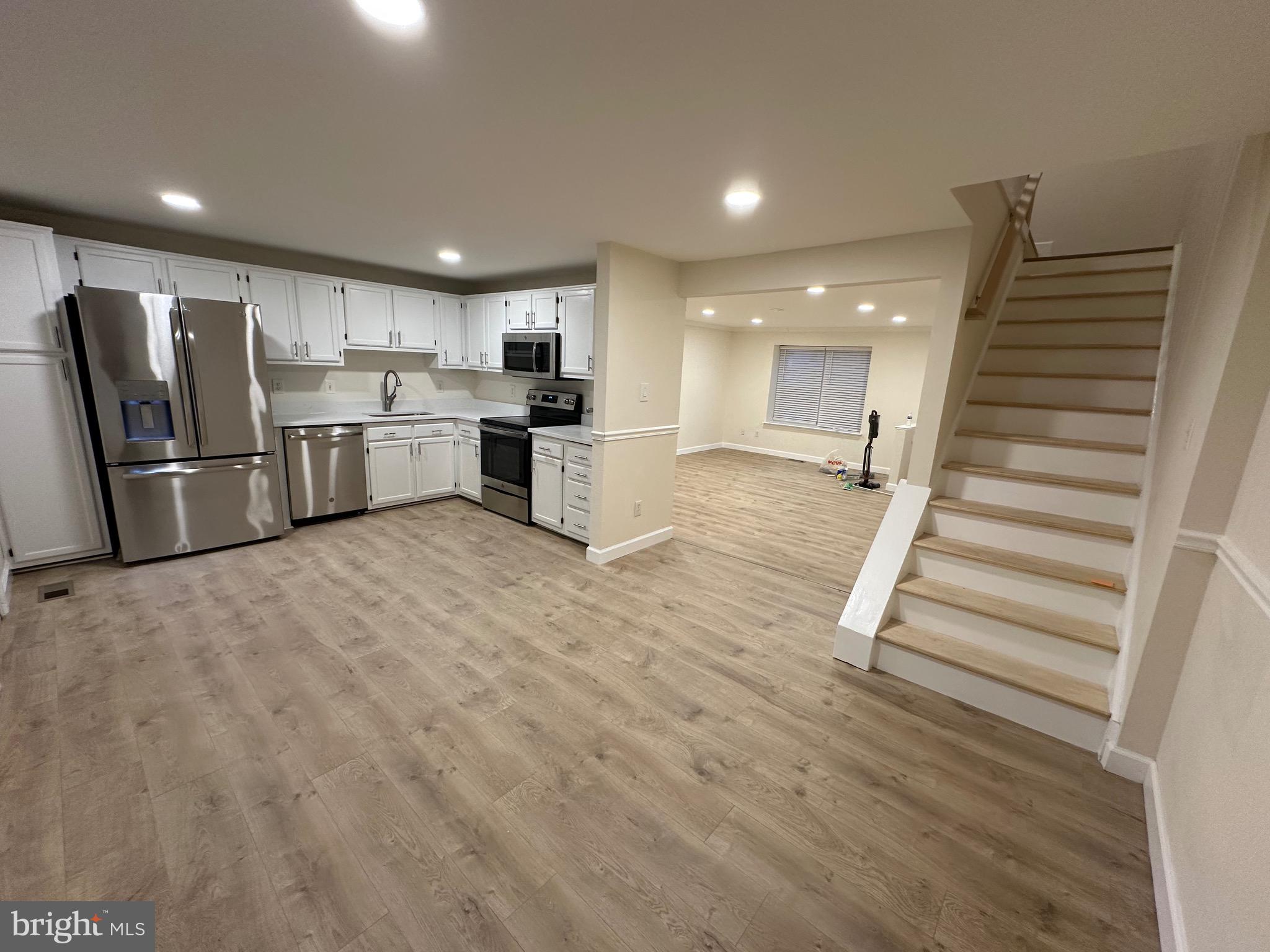 Step into luxury and comfort with this modern and newly renovated head to toe, new floor, fresh paint, new bathrooms, spotlights, high-ceiling, and neat home features three bedrooms, an additional bonus room in the basement, and three and a half bathrooms townhome in the coveted Heather Glen community.The main floor welcomes you with exceptionally spacious family room large enough for everyone in the family to have room and enjoy. Fantastic kitchen with NEW granite countertop with plenty of room for your eat in kitchen table and access to deck!
Primary bedroom, which boasts an en-suite bathroom. Two additional bedrooms share a full hallway bathroom. The lower level just finished and added new  full bathroom and extra room . 
A large recreation room is perfect for entertaining or relaxing. Wet bar and brand new bathroom. The walkout access to the backyard provides easy outdoor access. Conveniently located near public transportation and major roadways, including route one and I-95, commuting is a breeze. Enjoy easy access to local shops, restaurants, and parks.
