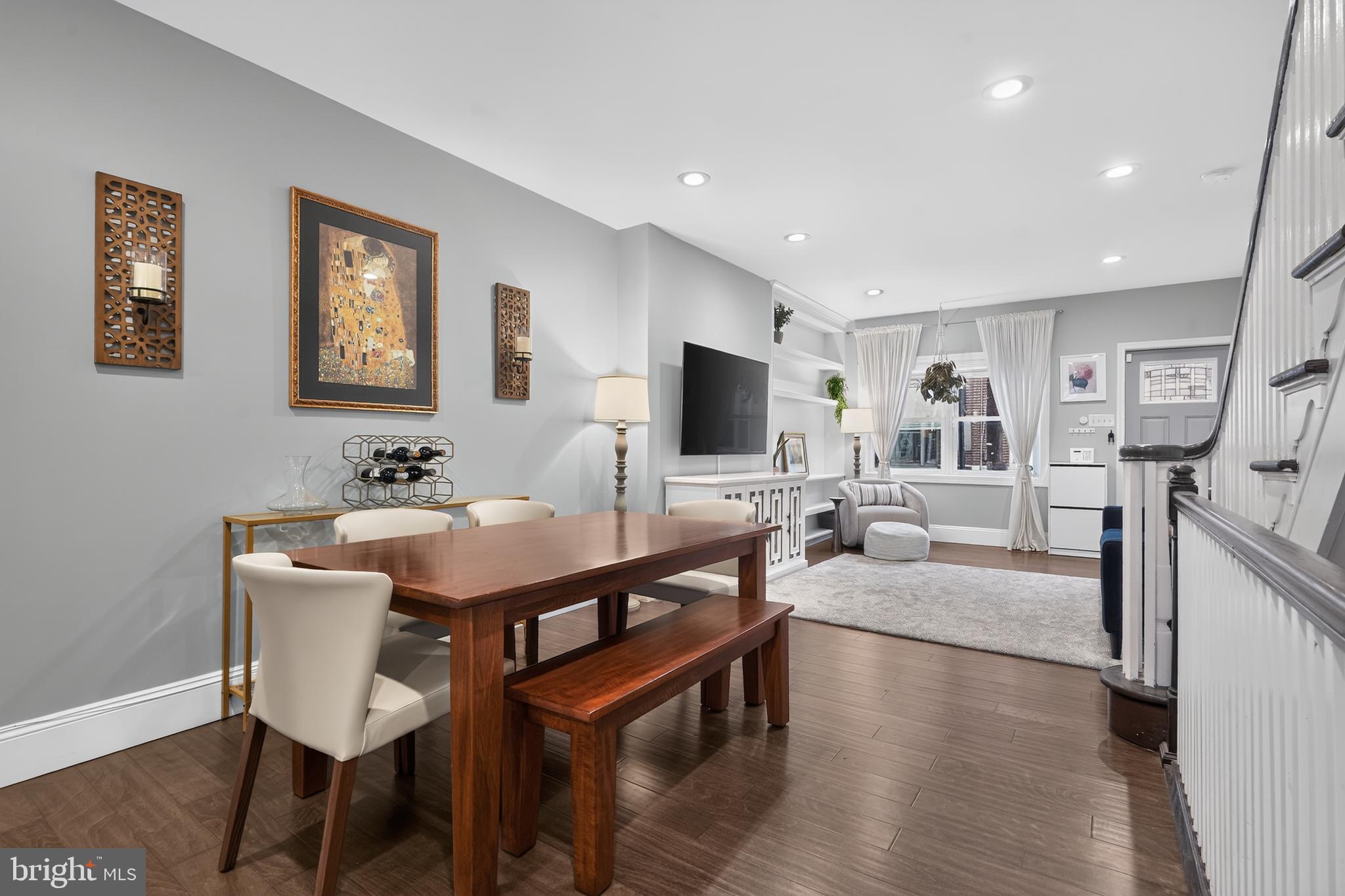 This charming home tucked away on quiet Warnock St. has been completely renovated and is MOVE-IN READY!  This lovely abode has been outfitted with every modern amenity including a tastefully updated kitchen and new baths, gleaming hardwood flooring, central AC, finished basement and so much more!   Its handsome brick facade with stately front door ushers you into the bright and spacious living area with recessed lighting, neutral decor and thoughtful, custom built-in shelving.   Accented by bright white wood trim, the living area blends effortlessly with the formal dining area, perfect for family dinners.  Here you'll also find a half bath, a rare convenience in a home of this era.  Enter the state of the art kitchen with ample white cabinetry, SS appliances, granite counters, a custom built-in pantry cabinet and even a breakfast bar with seating for a quick bite on-the-go.   From the kitchen, there is access to the private back yard with plenty of room for grilling and lounging on summer evenings.  Head down the open staircase to the basement level and you'll find a finished space for a family room, home gym, play area, home office or entertaining space, you decide.  On this level you'll also find a convenient laundry closet with full size washer/dryer and a large storage area.   Head up to the 2nd floor and you'll find 3 perfectly proportioned bedrooms and an impeccably updated hall bath with beautiful tile accents, tub/shower combination and spa-like fixtures.  The primary bedroom is spacious, bright and has custom closet built-ins to keep everything accessible and organized.  Top this all off with central AC and you have the perfectly updated place to call home!  Conveniently located to public transportation, the sports complex and walk-able to the world class restaurants and shopping on East Passyunk and the historic Italian Market.  See it today! This one won't last!