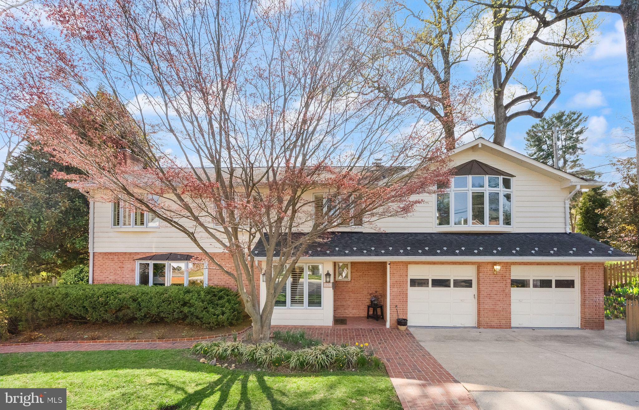This stunning single-family home in the heart of Arlington, VA, offers over 3,800 square feet of beautifully designed living space. With four spacious bedrooms, three luxurious bathrooms and a charming powder room, as well as multiple living areas, this residence provides plenty of room for comfortable living and entertaining.

The main level boasts gleaming hardwood floors, leading you through an inviting layout to a huge living area and adjoining dining room. The gourmet kitchen is a chef’s dream, featuring a breakfast bar, premium granite countertops, stainless steel appliances, a double oven, cooktop, refrigerator, dishwasher, and ample storage. The kitchen and dining spaces lead to the exterior decks which are ideal for entertaining.

Gather by the fireplace in the cozy den or step outside onto the spacious deck, perfect for hosting guests or enjoying a serene evening. The deck feels private with its unique views and beautiful design. There is also a large, retractable awning that allows for entertaining with any type of weather! Upstairs, the bedrooms are thoughtfully designed with comfort in mind, offering a mix of hardwood and carpeted flooring. The bathrooms are elegantly appointed and they offer plenty of space for getting ready or retiring from the day. The master bath has heated tiles and a large soaking tub.

The upper level also offers a generously sized bonus room with gorgeous, wide stairs. The options are endless for this sun-drenched room that could serve as an owner's suite large den or another space to escape from it all. The convenient laundry room adjoins this space and its upper level location makes laundry easy for day-to-day living.  A walk-out club room downstairs offers a brand new mini-kitchen & bar in the large space that leads to the outdoor covered entertaining area. On this level there is also a large bathroom with steam shower! Laundry is made convenient with a second in-home washer and dryer in the lower level. Parking is a breeze with an oversized attached garage with extra storage.

The backyard offers two amazing entertaining areas! The large fully fenced yard is great for privacy and for your pets. Green space abounds on this beautiful lot and the mature trees and landscaping put the final touches to this luxurious living. Nestled in a desirable location, this home combines style, functionality, and convenience. Schedule your private showing today and experience the charm and sophistication of 2501 N Nelson St for yourself!