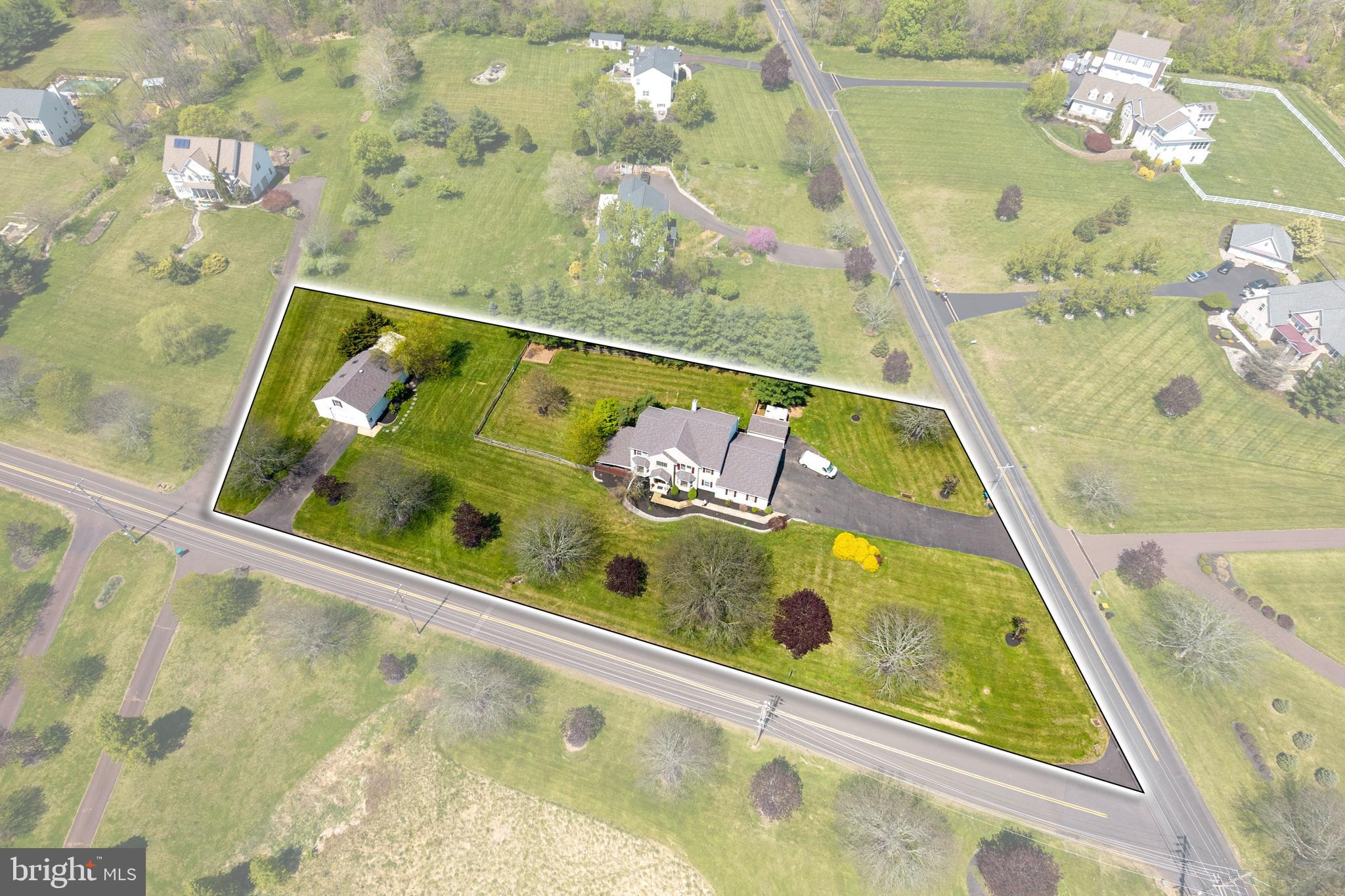 Usually there’s a compromise baked in somewhere, this one skipped that part. Welcome to 1265 Moyer Road.

Before you even step into the main house, there’s a separate driveway leading to a detached garage. Oversized door, real workspace, and a finished space above with a kitchen, living room, bedroom, full bath, laundry, its own heating system, and a pellet stove. Beautiful wood floors run throughout the space.

The main house sits on 1.5 acres in the Souderton School District and offers over 5,500 square feet of finished space. You walk into a two-story foyer with a turned staircase, a dining room on one side and an office with French doors on the other. Straight ahead, the kitchen opens up with a large island, plenty of cabinet space, and strong natural light, along with a slider out to the deck overlooking the fenced backyard. It flows right into the family room, which includes both a pellet stove and a gas fireplace.

The first floor also includes a spacious laundry room, powder room, and access to an oversized three-car garage.

Upstairs, all four bedrooms are well-sized and each includes a ceiling fan. The hall bath has been updated, and the primary suite includes a sitting room, gas fireplace, walk-in closet, and a large private bath.

The walkout basement is fully finished with wood-look tile flooring, a wet bar, full bathroom, and access to a covered patio with a hot tub.

The updates that matter are already handled. Most of the home has been freshly painted, all carpeted areas have been replaced, and the major systems include a newer roof, geothermal HVAC, backup generator, and a tankless hot water heater.

Between the main house, finished basement, and the detached garage with a finished space above it, this is a property that gives you options you don’t usually find in one place.